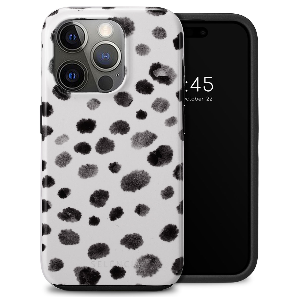 Coque de téléphone blanche à pois noirs, couvrant un téléphone.