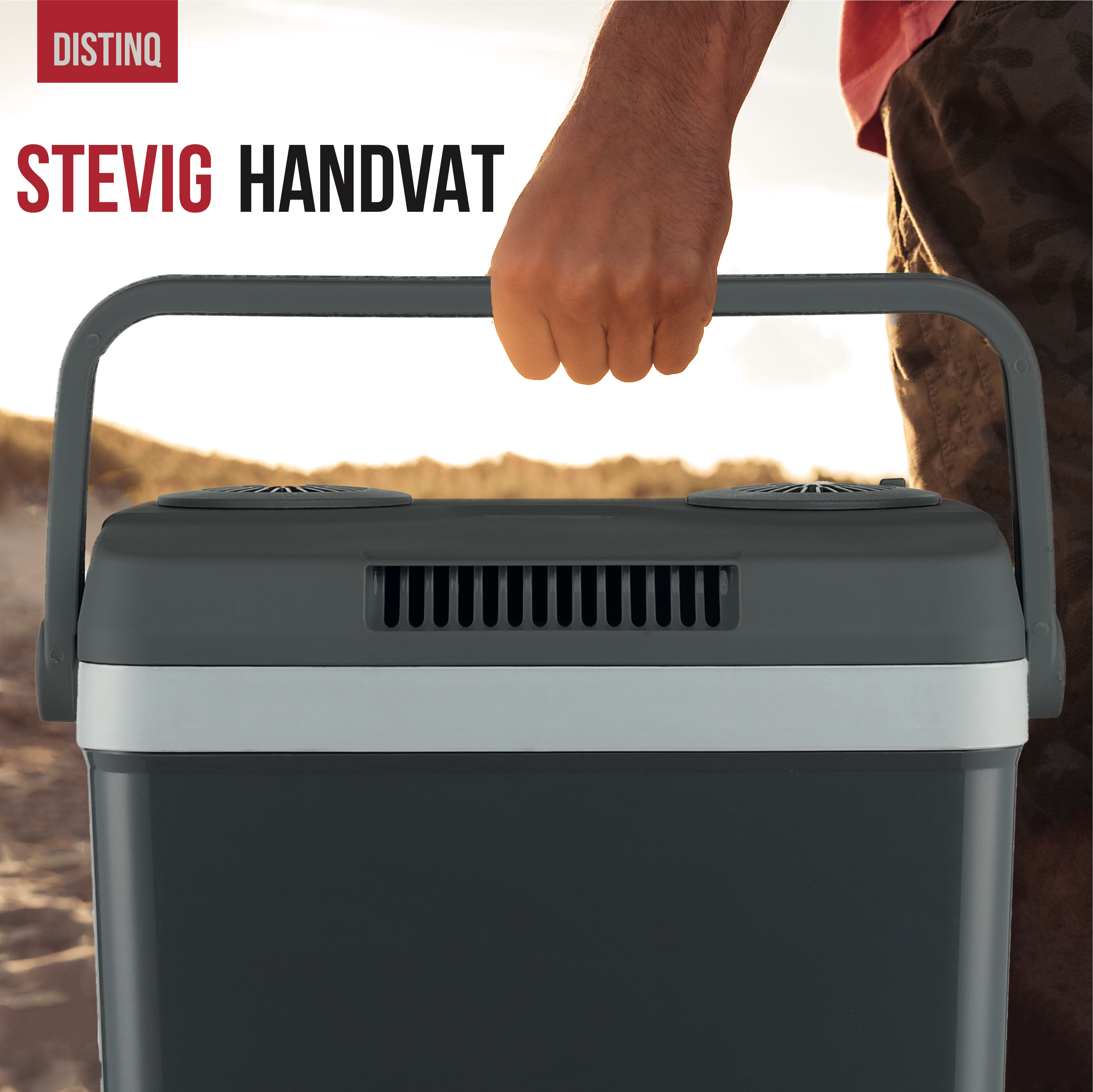 Person holding a cooler handle. The cooler has a gray and white design, DISTINQ brand.