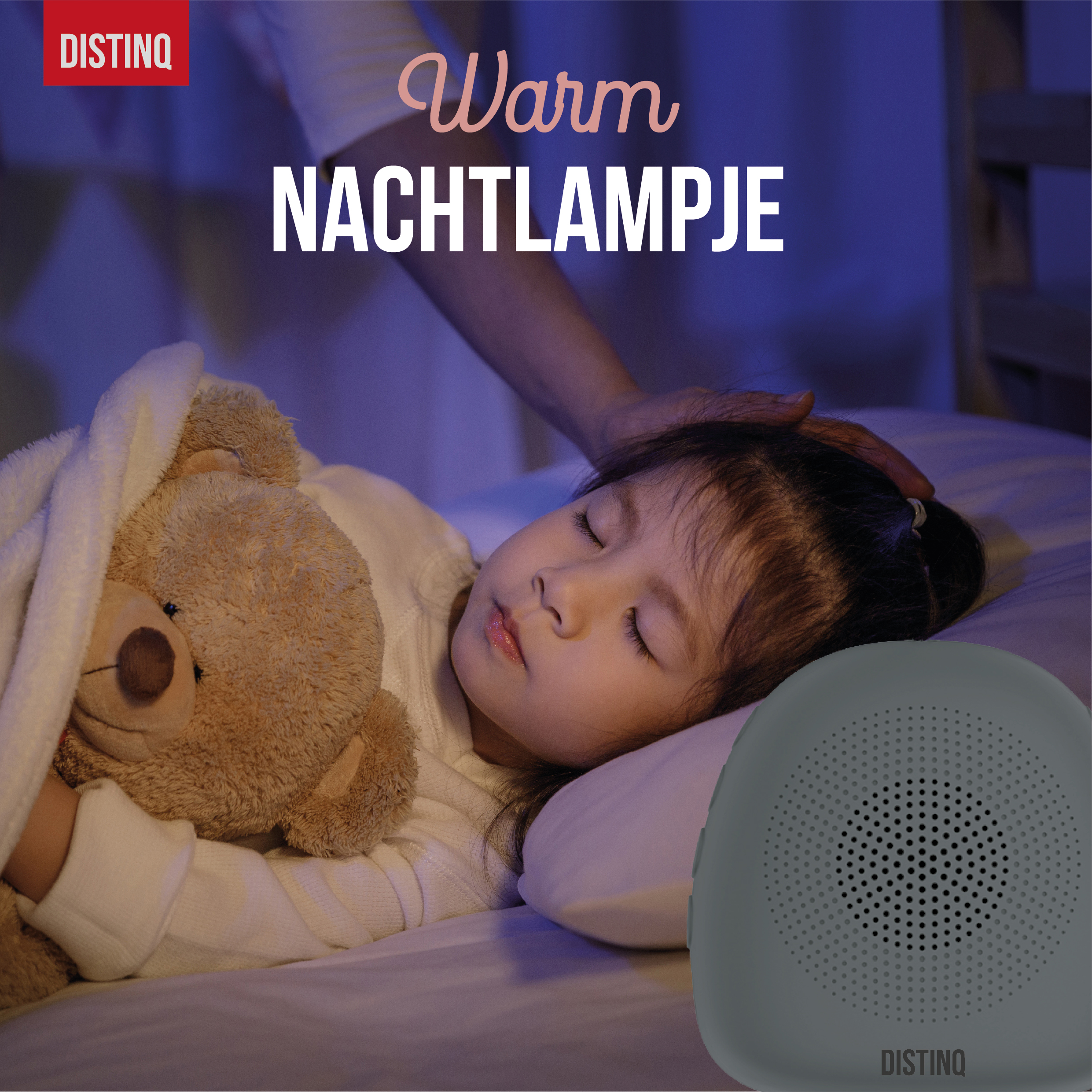 A sleeping child with a teddy bear, with a night lamp on the side.