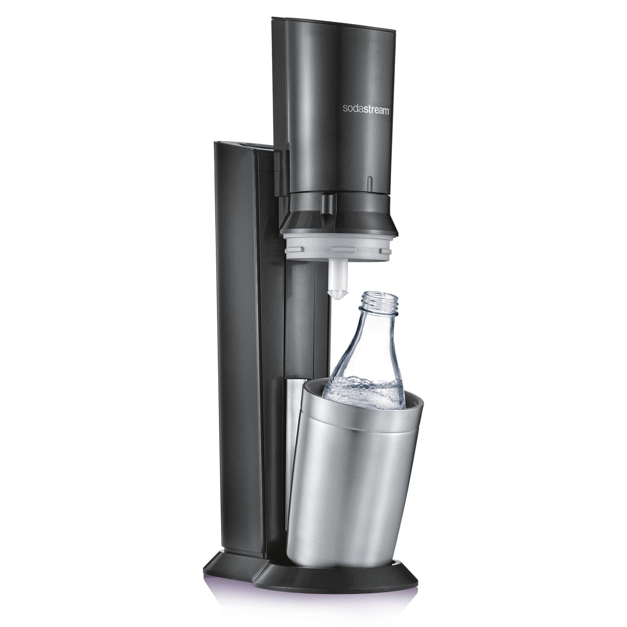 A black and silver SodaStream machine with a glass bottle inside.