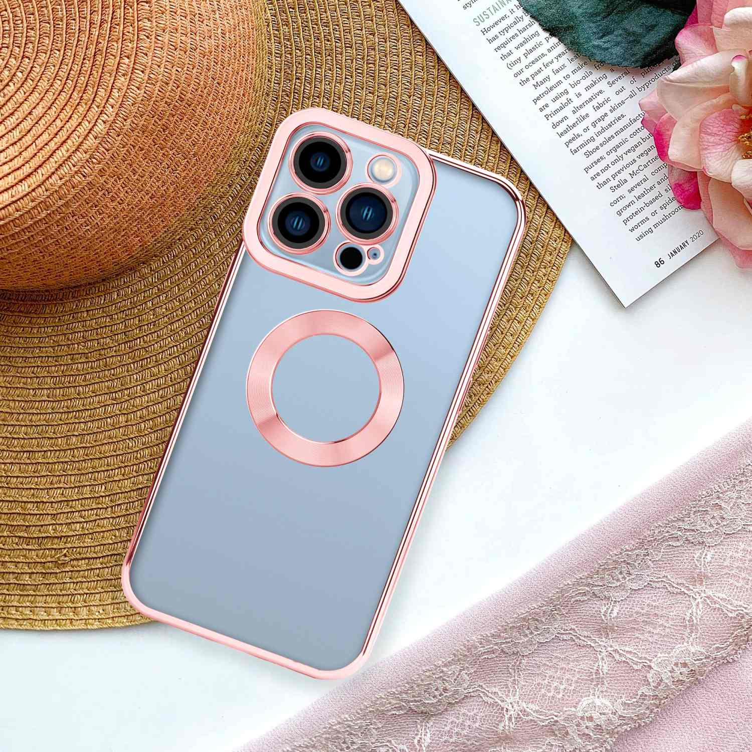 Roségoldenes Handycase mit durchsichtigem Rücken und schwarzem Ring, auf floralem HG.