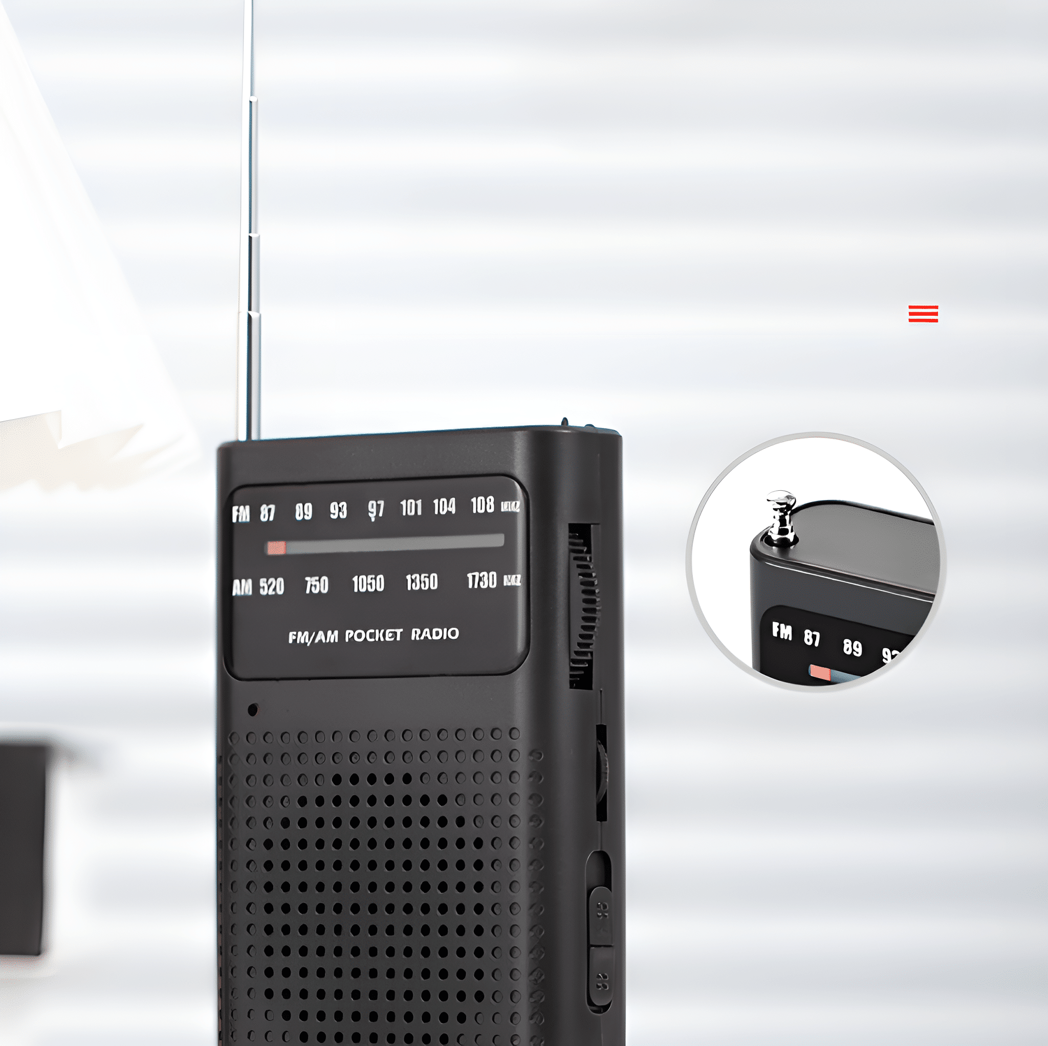 Ein schwarzes Taschenradio mit silberner Antenne, das einen Abstimmregler und eine Frequenzanzeige zeigt, Nahaufnahme.