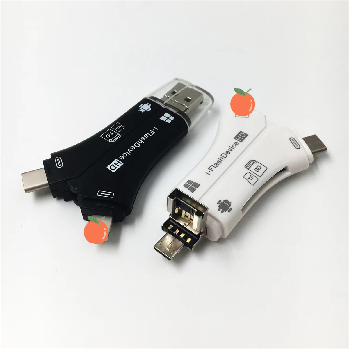Zwei schwarz-weiße Kartenleser mit USB- und SD-Kartensteckplätzen und einem orangefarbenen Aufkleber.