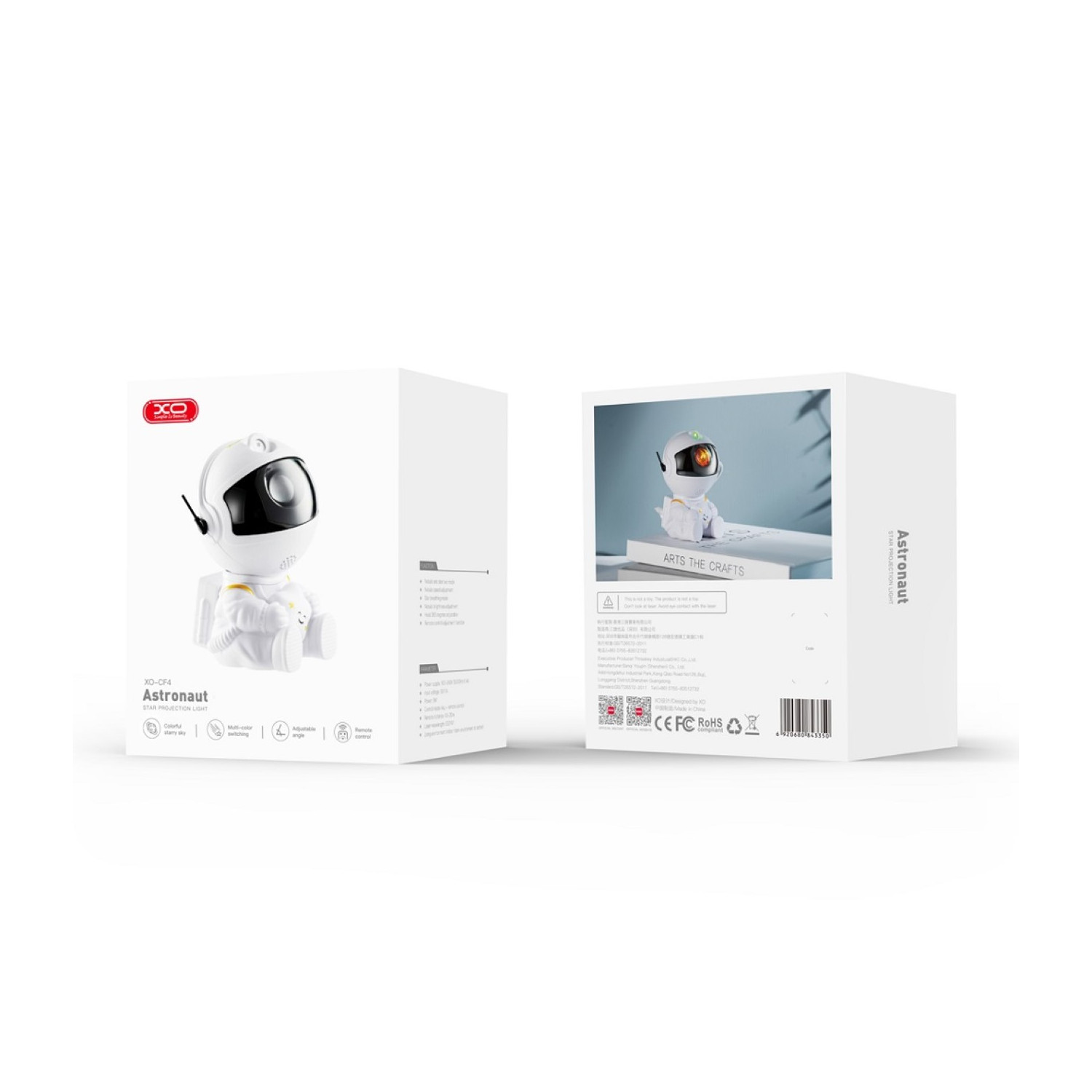 Zwei Kartons mit einer Astronautenlampe. Vorderseite zeigt Lampe, Rückseite Produktinfo und Bilder.