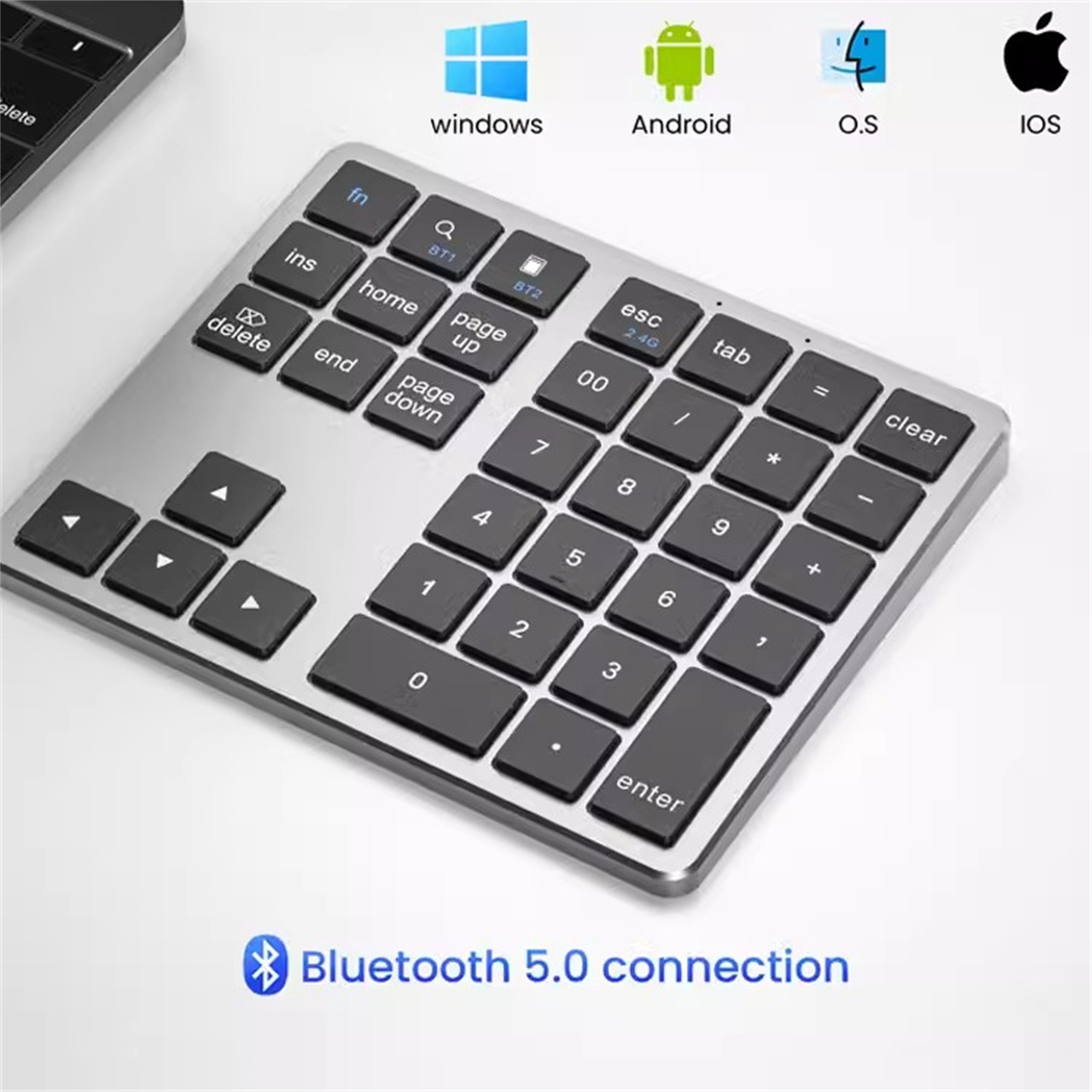 Silberner Ziffernblock mit schwarzen Tasten. Windows, Android, O.S und IOS Symbole oben.