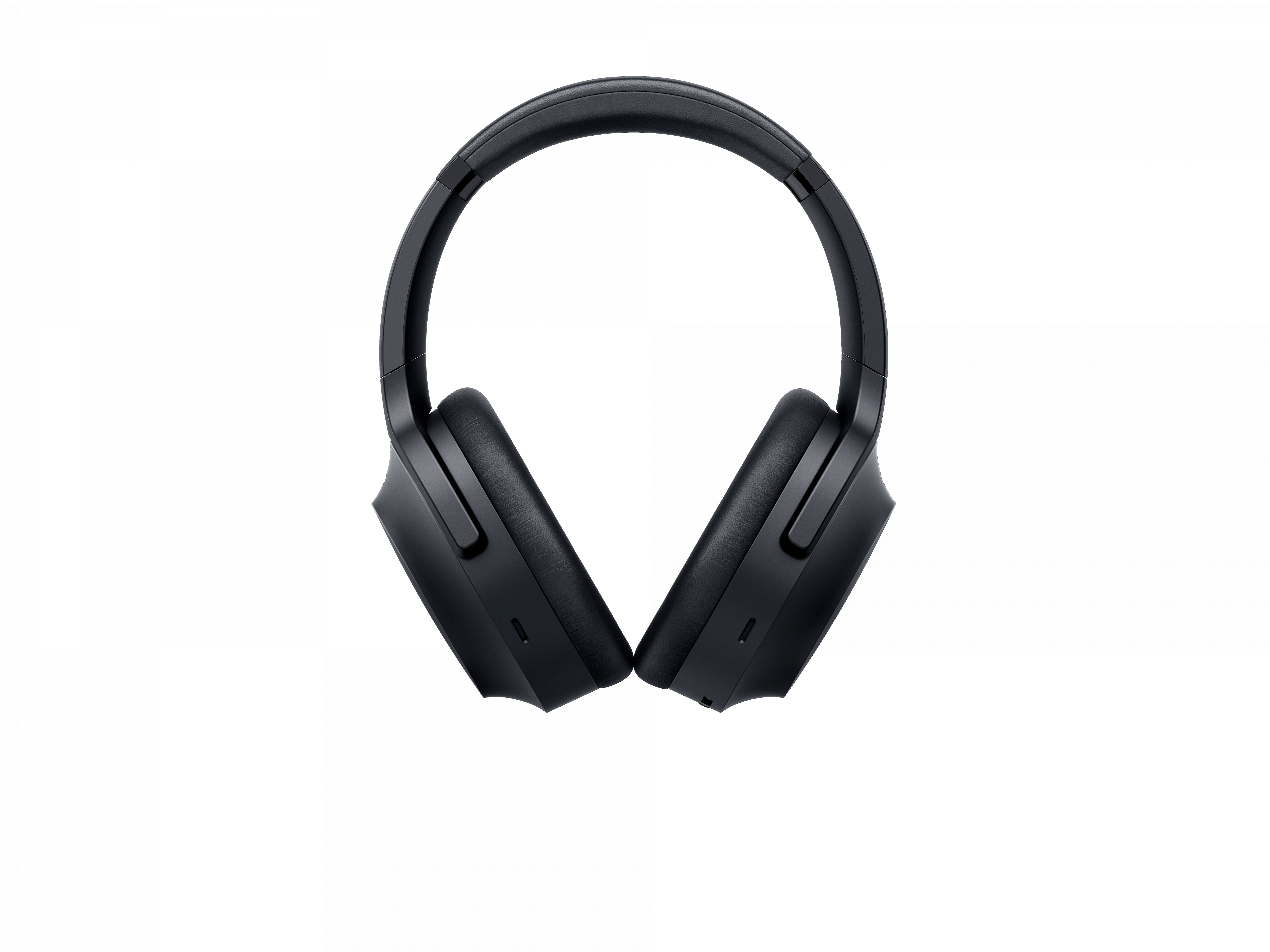 Czarne słuchawki nauszne na białym tle, pokazujące muszle uszne.