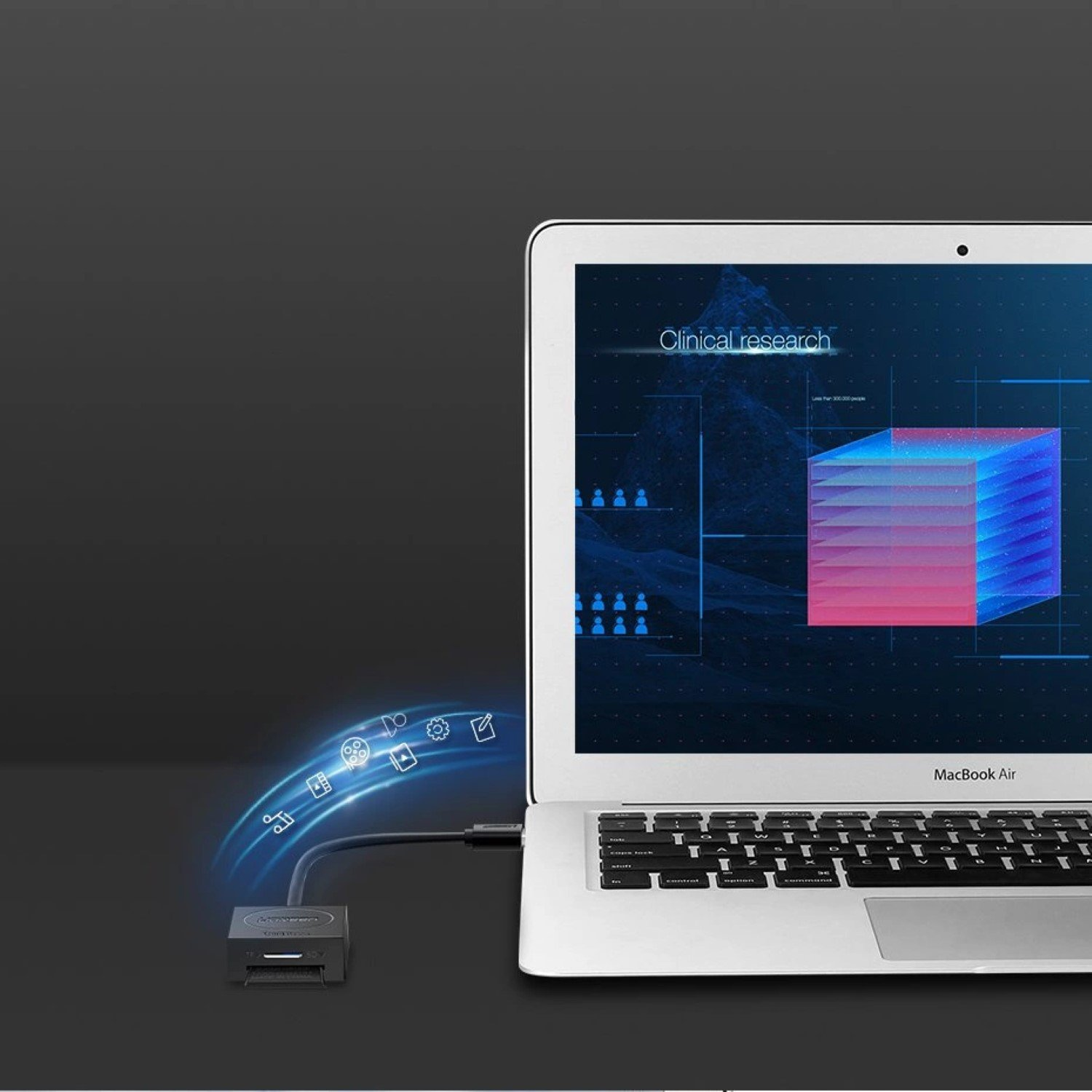 Ekran laptopa wyświetlający wykres badań klinicznych, połączony z urządzeniem zewnętrznym z ikonami, na ciemnym tle.