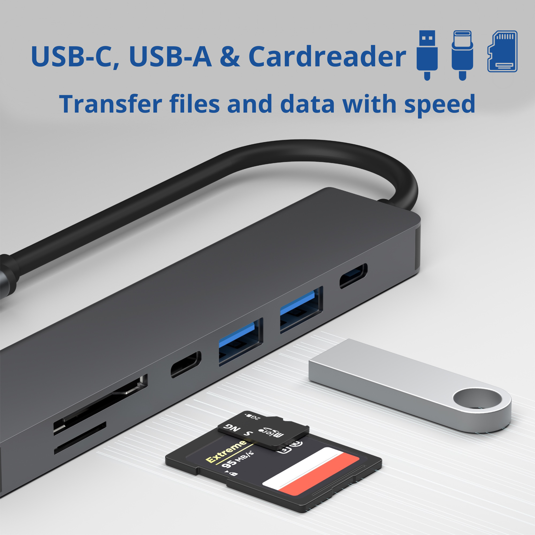 A black hub with USB-C, USB-A, and card reader, with a silver USB drive.