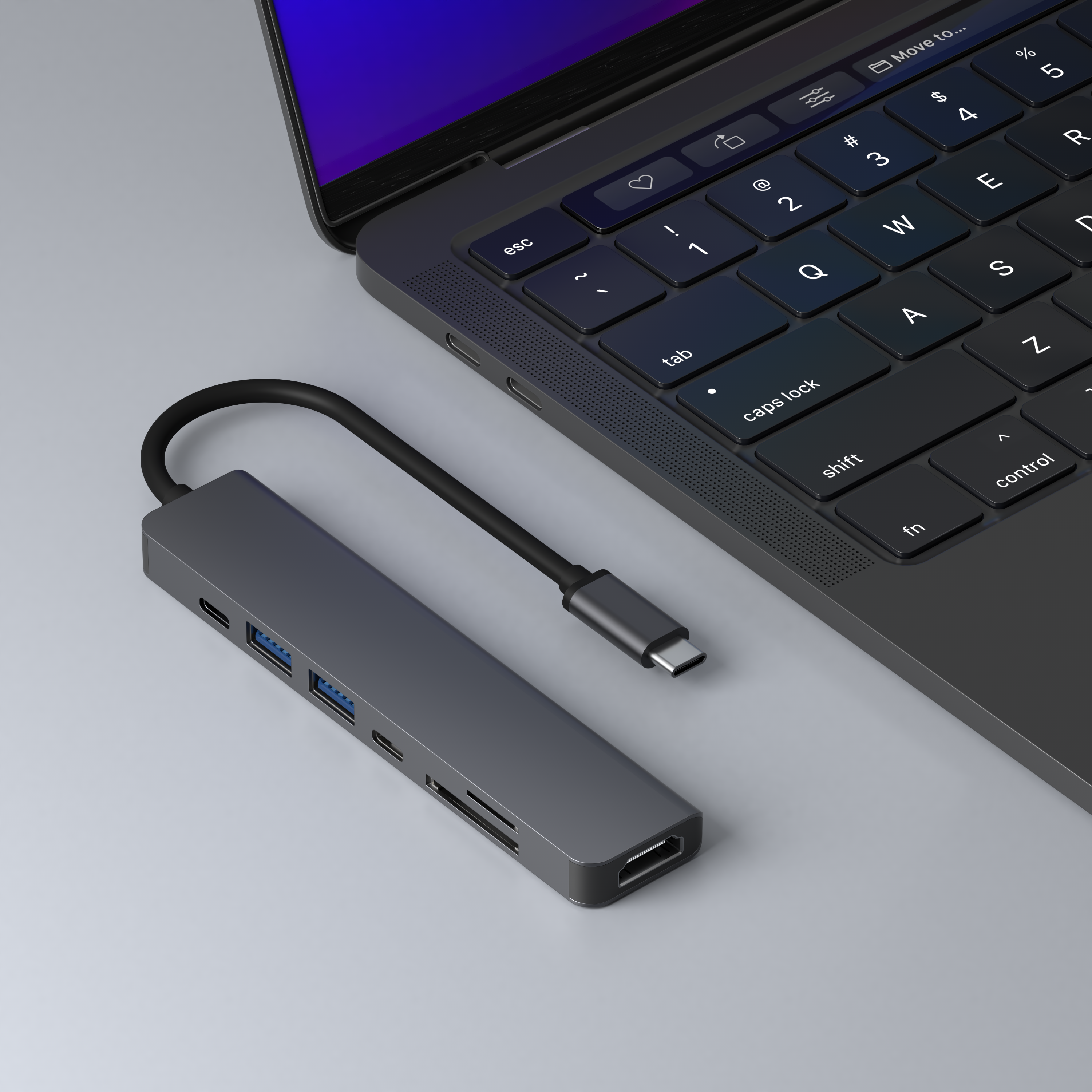 A grey USB-C hub connected to a laptop. It has various ports for connectivity.