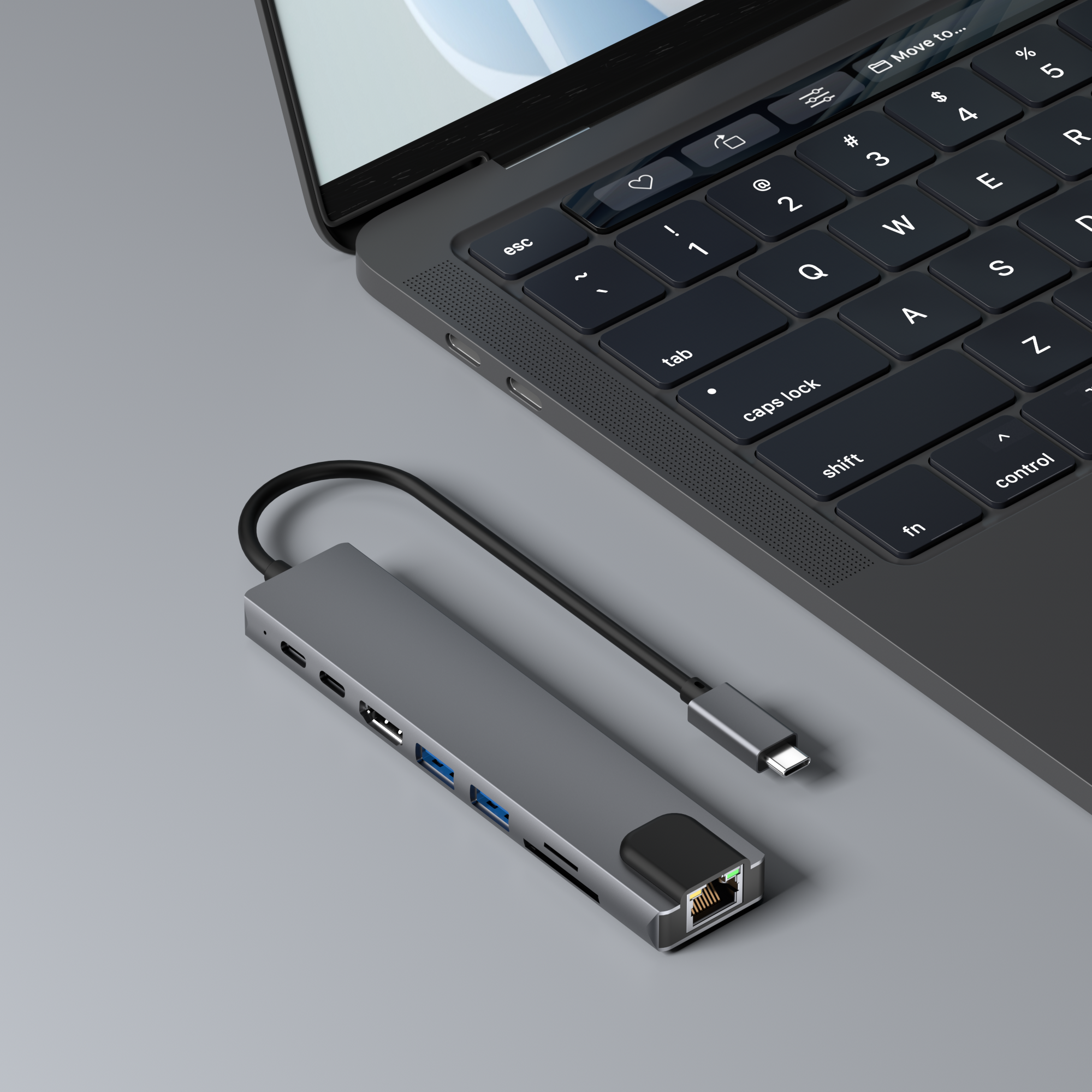 Ein grauer Hub, der mit einem Laptop verbunden ist, mit einer Vielzahl von Anschlüssen.