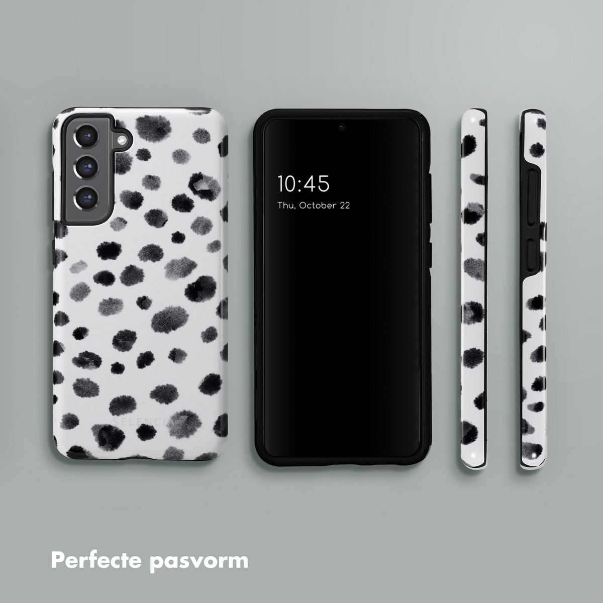 Tre telefoni e custodie. Un telefono è nero, gli altri due sono in custodie a pois bianchi e neri.