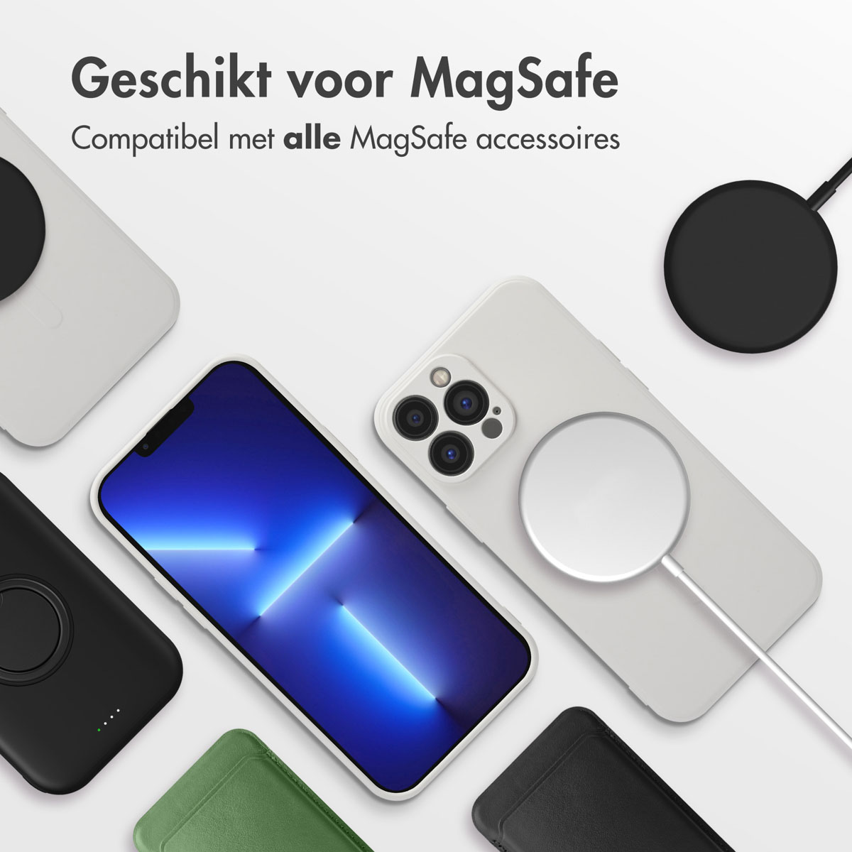 Plusieurs téléphones et accessoires, dont des chargeurs et des étuis, sont disposés sur une surface blanche.