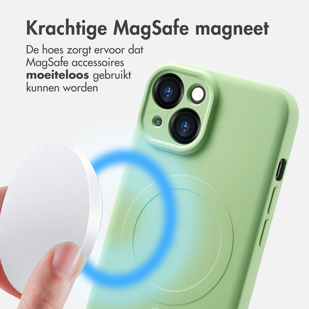 Green phone case with white magnetic circle. Hand holding a white magnetic disk. Blue glow.