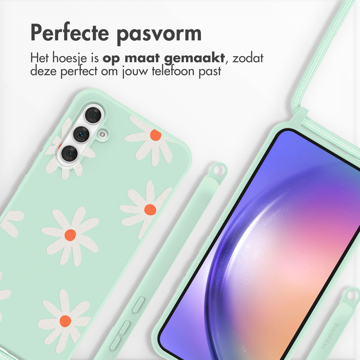 Coque de téléphone vert menthe avec un motif de marguerites et un cordon. Un téléphone est visible.