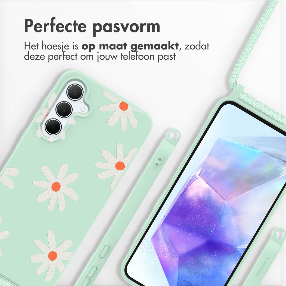 Une coque de téléphone vert menthe avec un motif de marguerites blanches, une lanière et un stylo assortis.