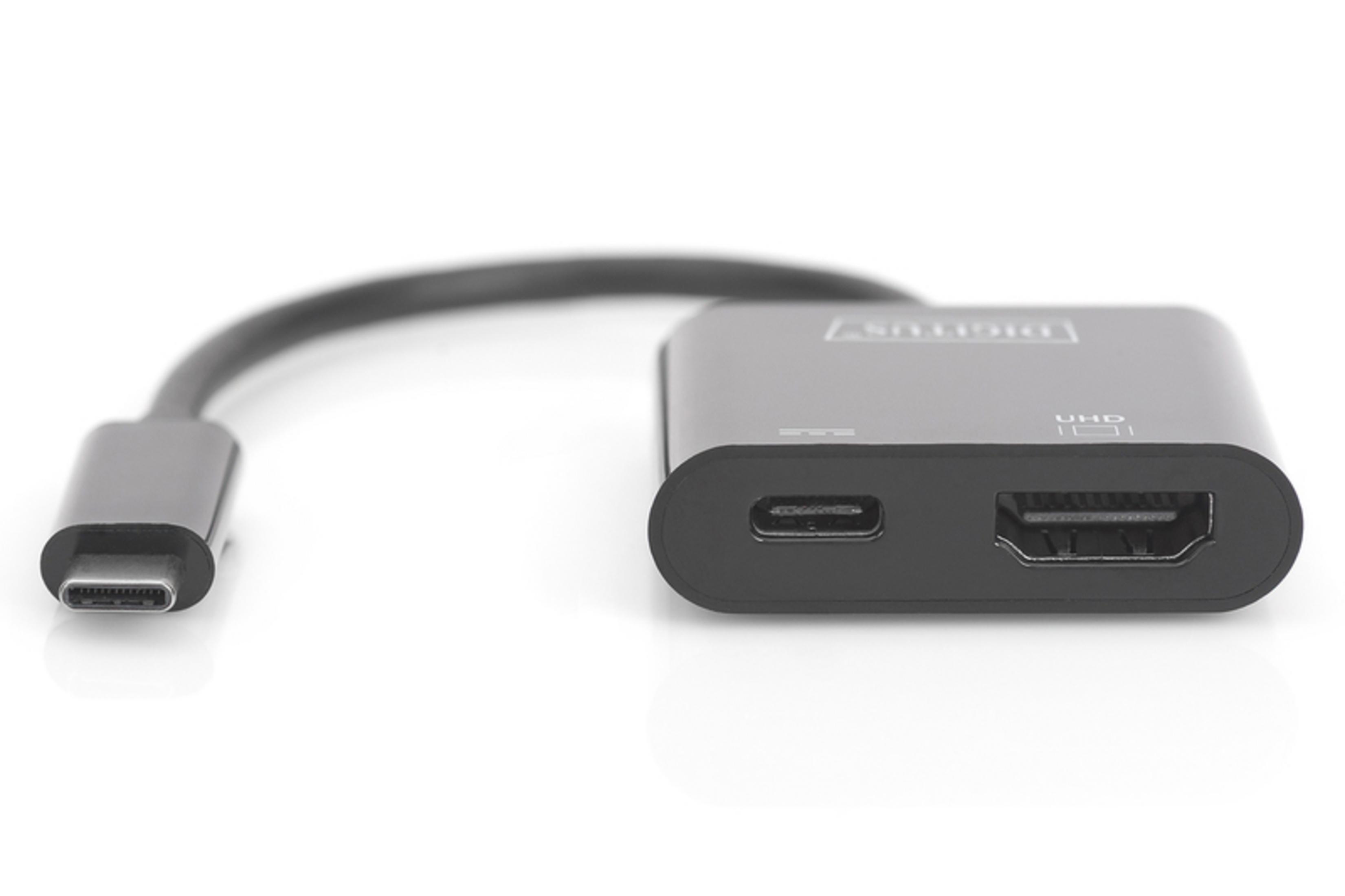 Ein schwarzer USB-C-auf-HDMI-Adapter mit einem USB-C-Stecker links und einem HDMI-Anschluss rechts.