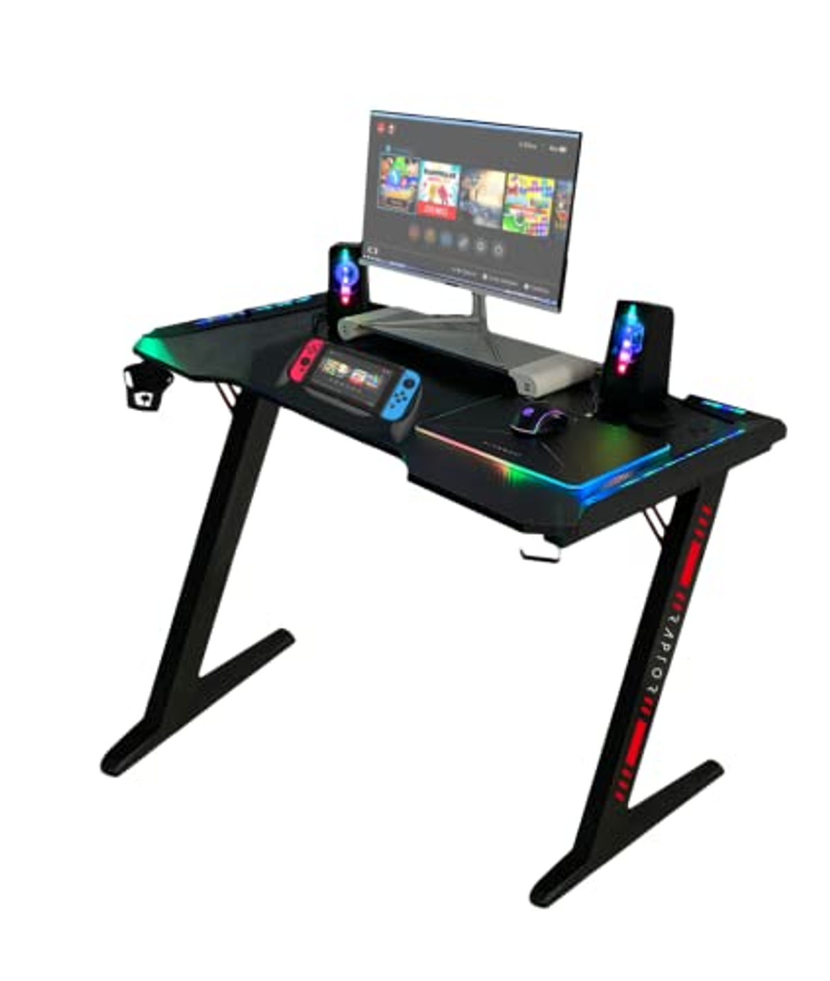 Gaming-Schreibtisch mit Monitor, Lautsprechern und Peripheriegeräten. Schwarzer Schreibtisch, weißer Hintergrund.