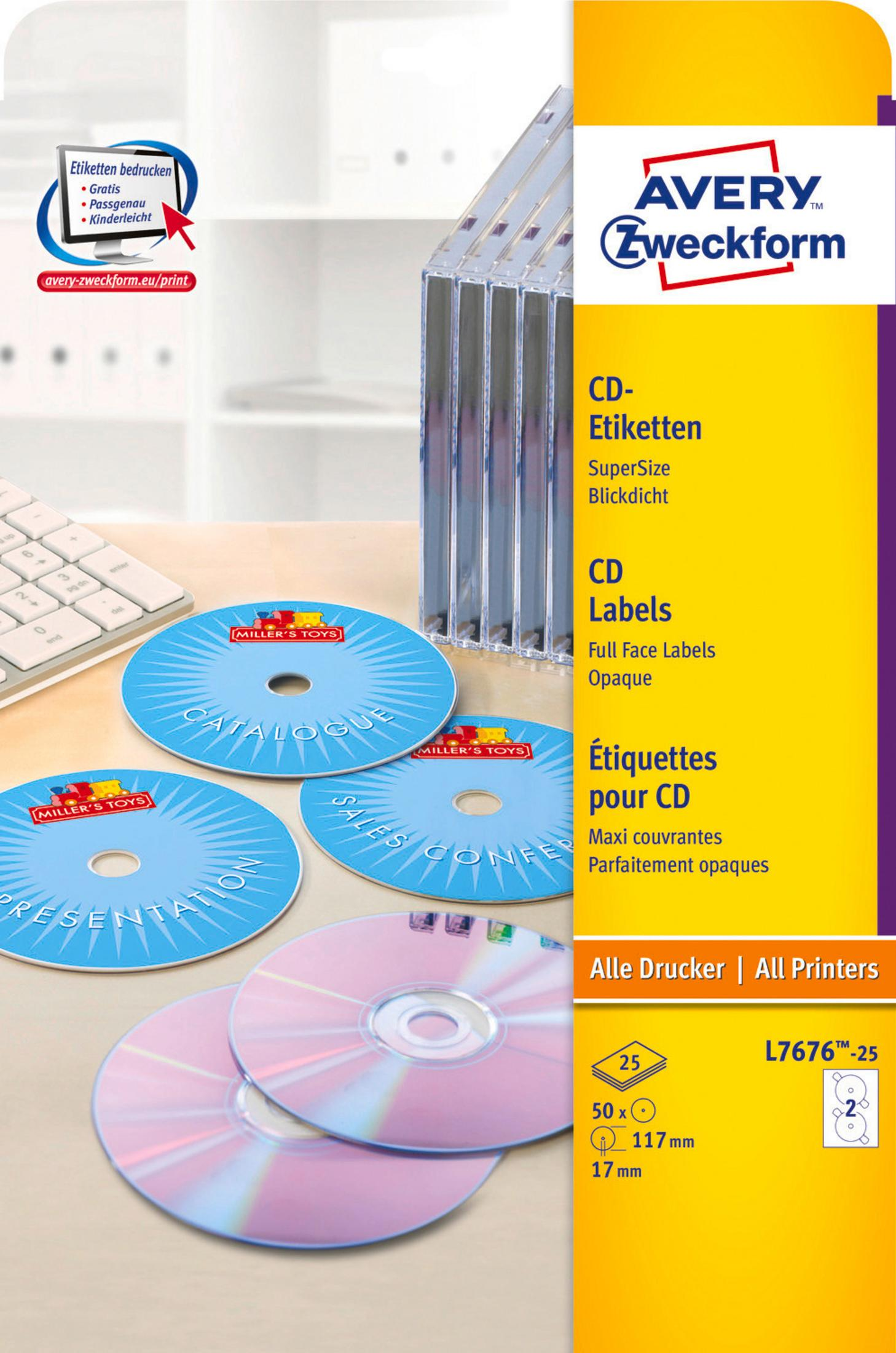 Blaue CD-Etiketten und CDs auf einem Schreibtisch mit Tastatur und Drucker-Etikettenbox.