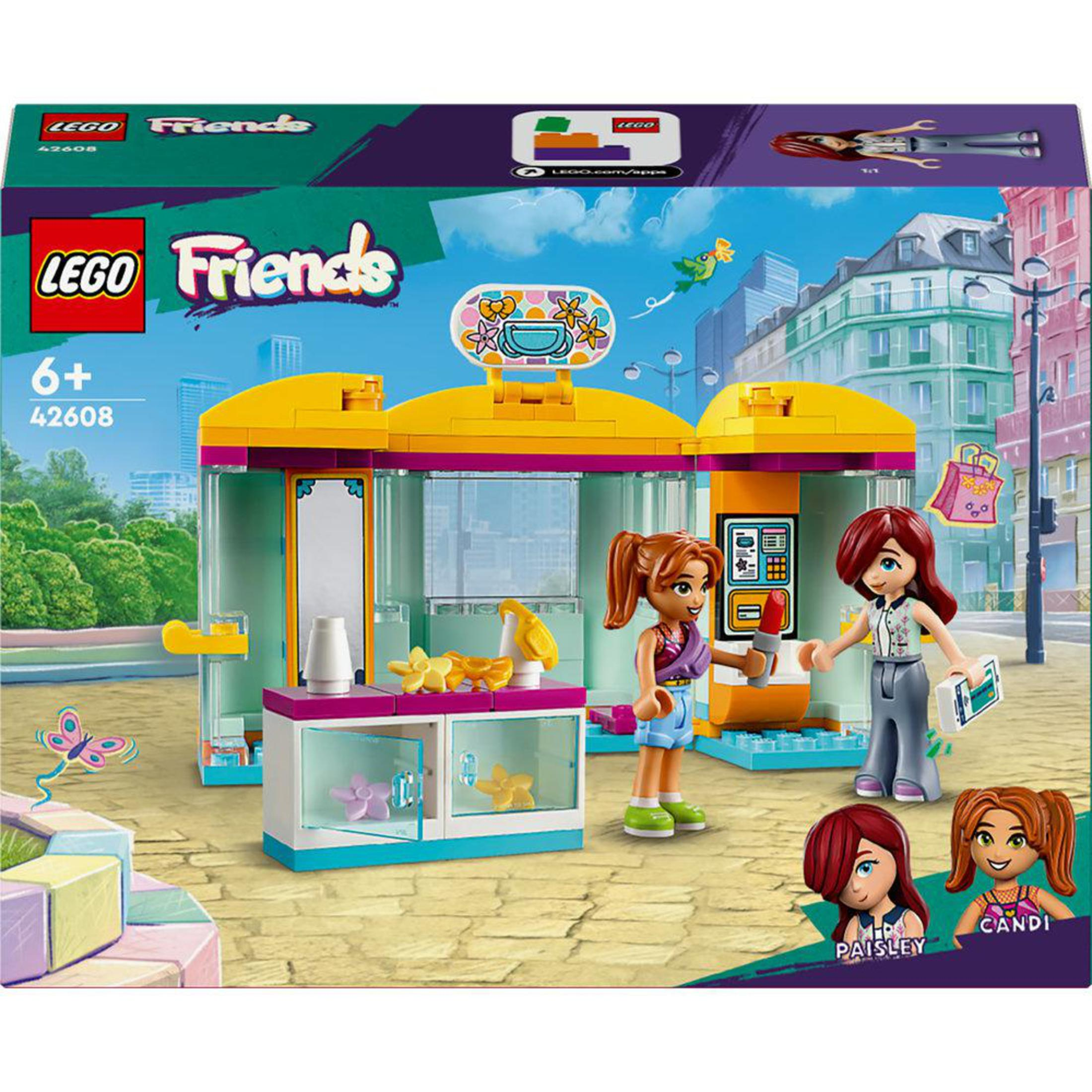 LEGO Friends Set-Box. Zeigt zwei Figuren und ein Gebäude mit einem Schild und Display.