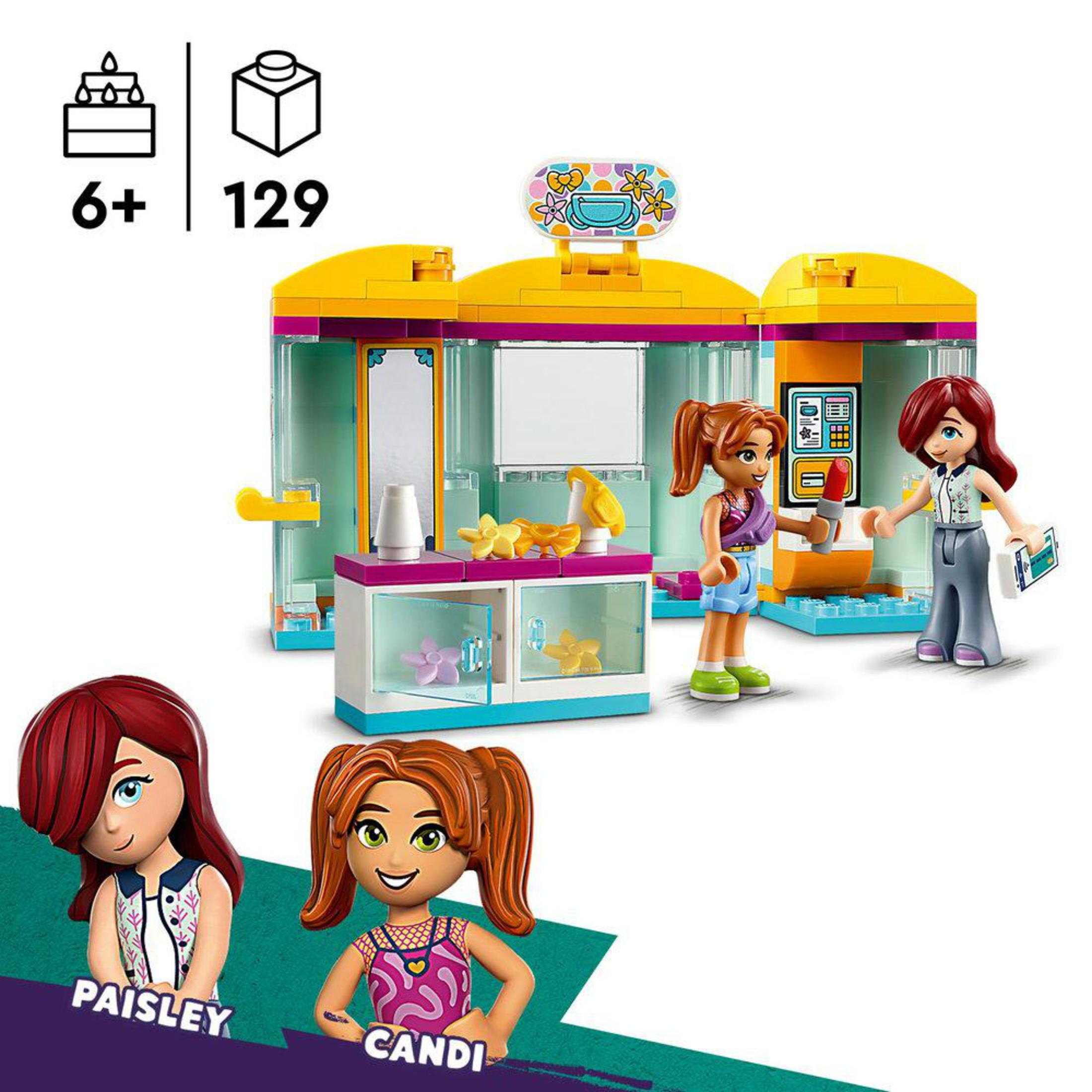 Lego-Set mit drei Mädchenfiguren und einem Laden. Text: '6+ 129'.