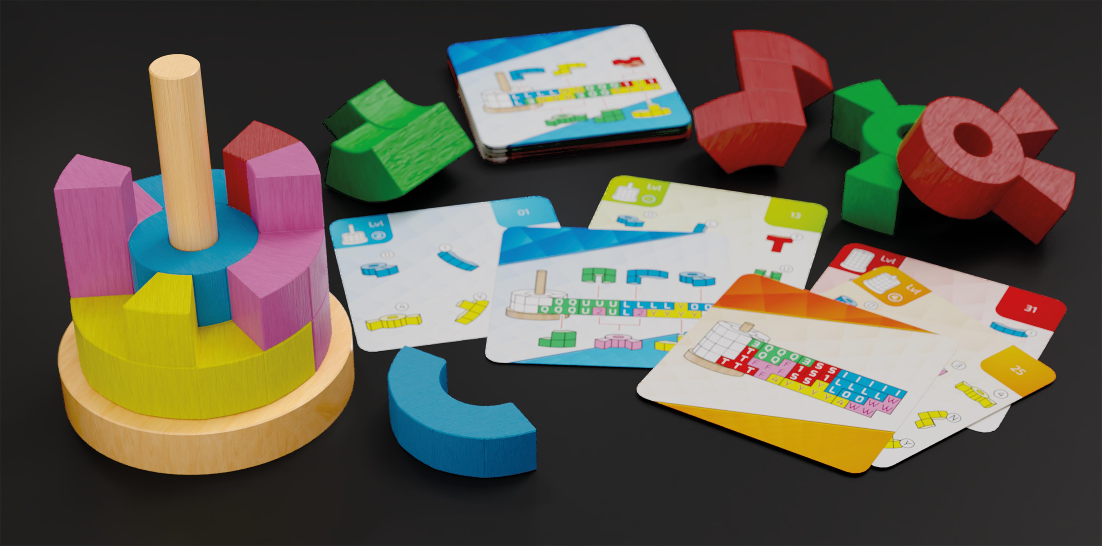 Blocs de construction en bois, cartes et une tour en bois sur une surface noire.