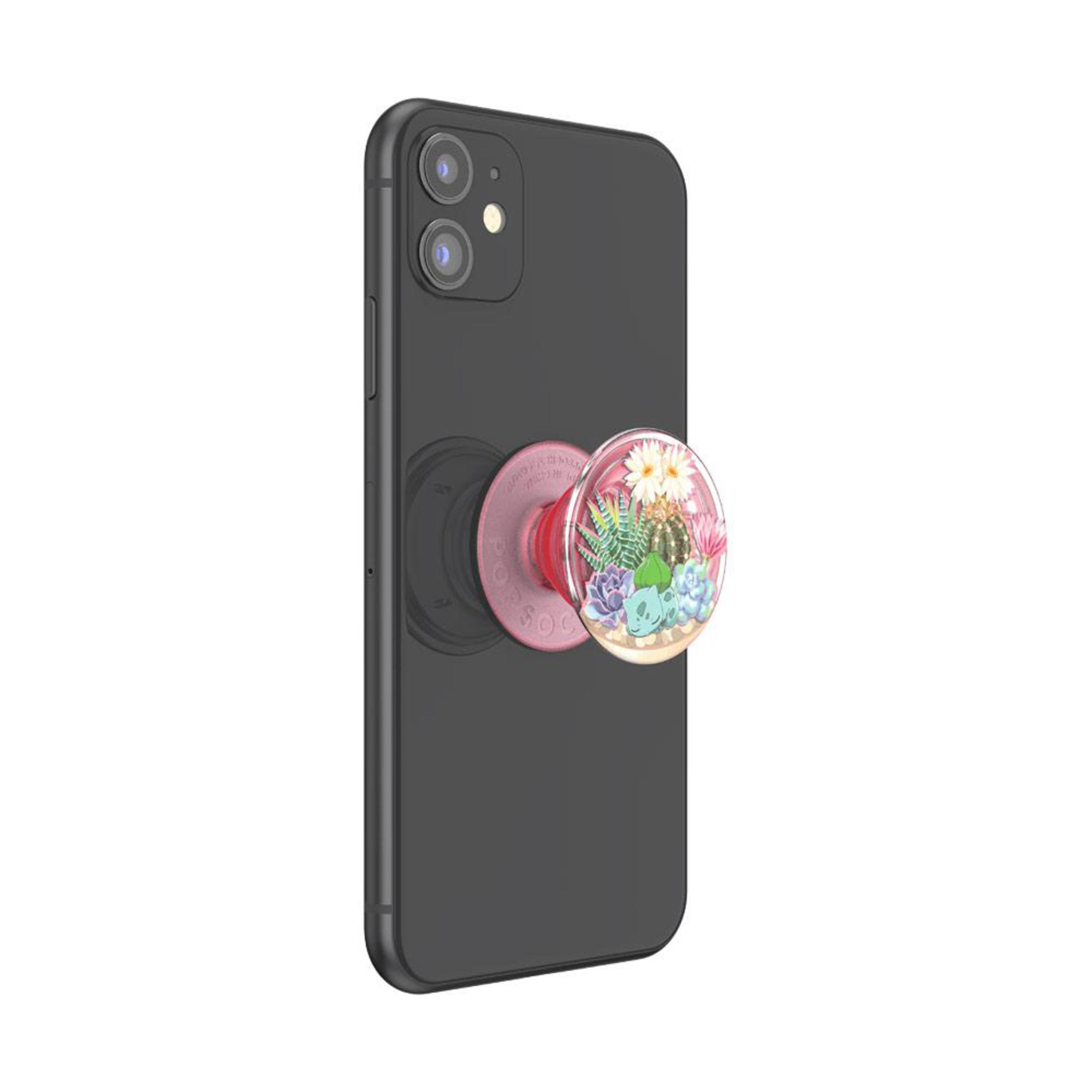 Telefono nero con un pop socket attaccato, che mostra fiori. Sfondo bianco.