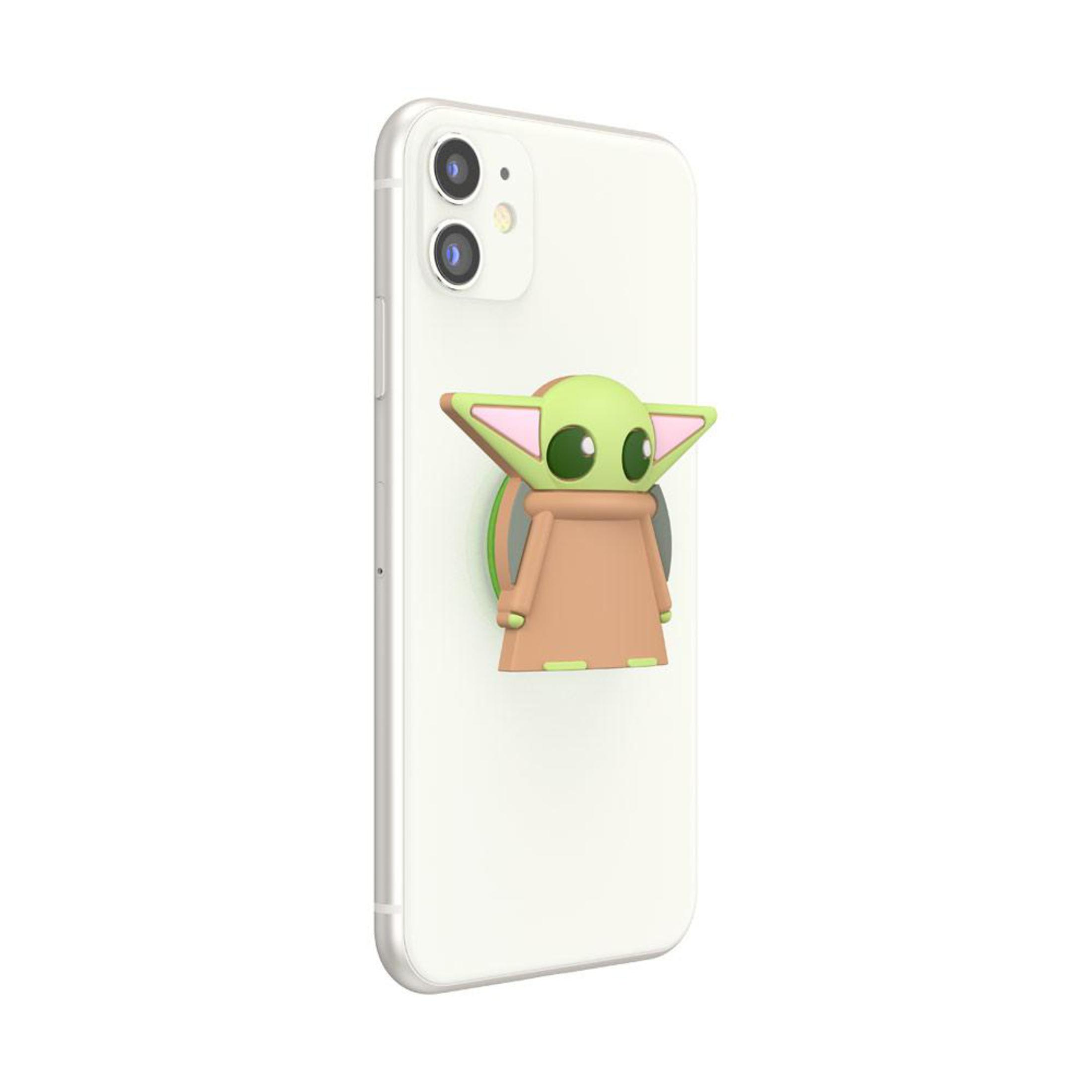 Ein weißes Telefon mit einem grünen PopSocket. Baby Yoda ist grün, beige und rosa.