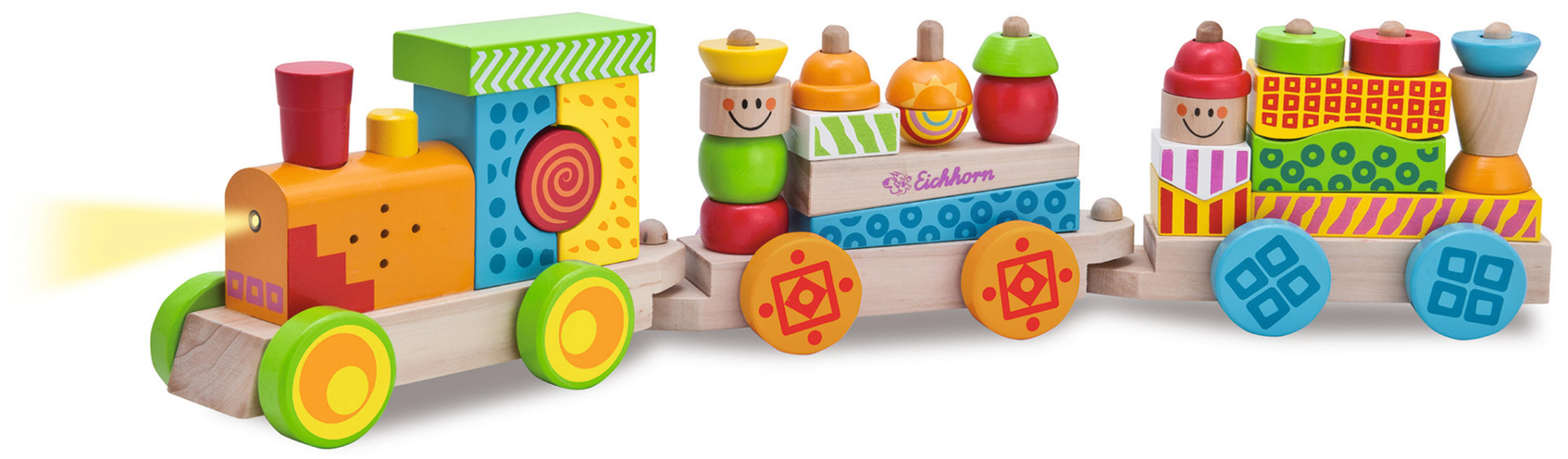 Holzspielzeugzug mit bunten Blöcken auf den Wagen. Die Vorderseite hat ein Licht.