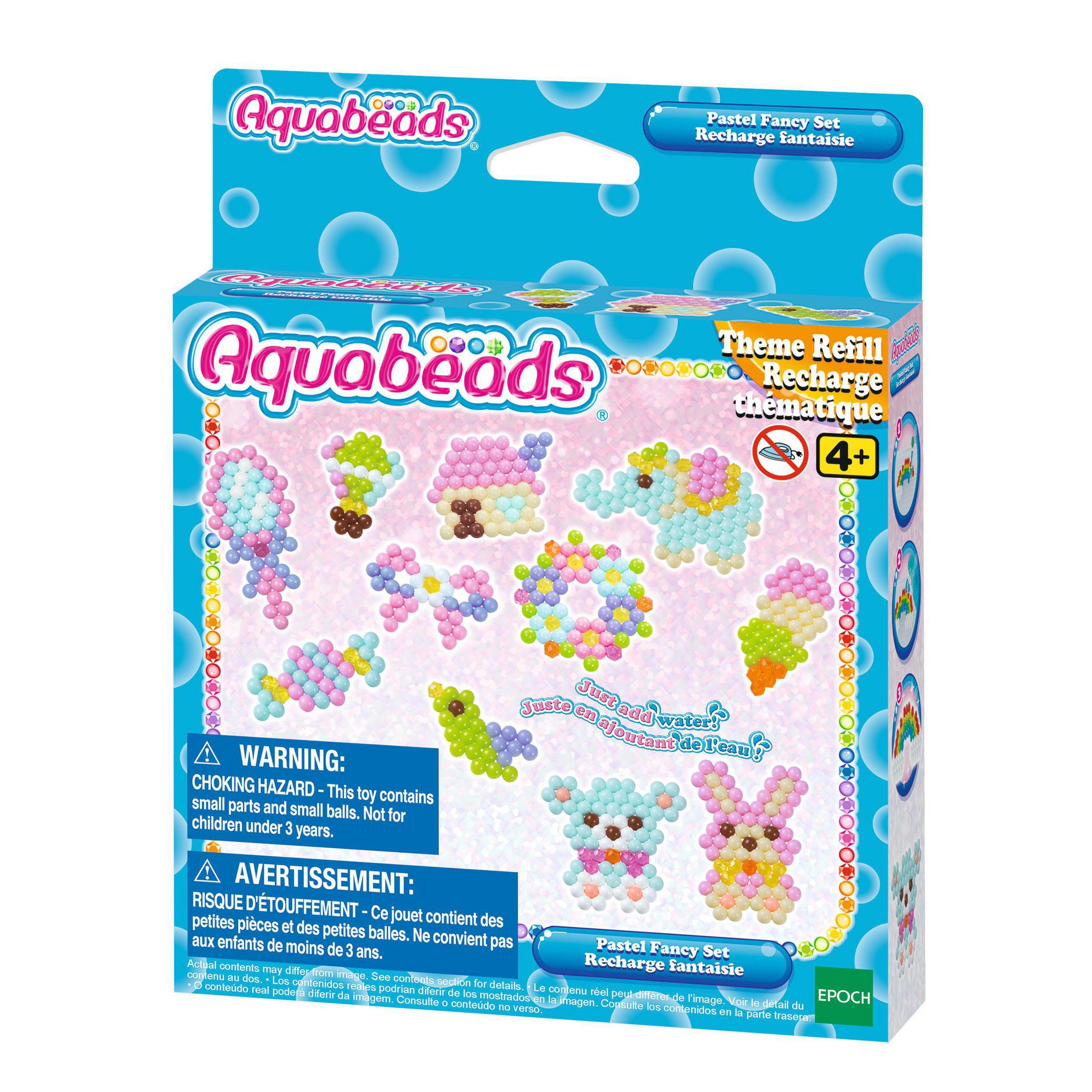 Aquabeads-Box mit Inhalt und einem Warnhinweis.