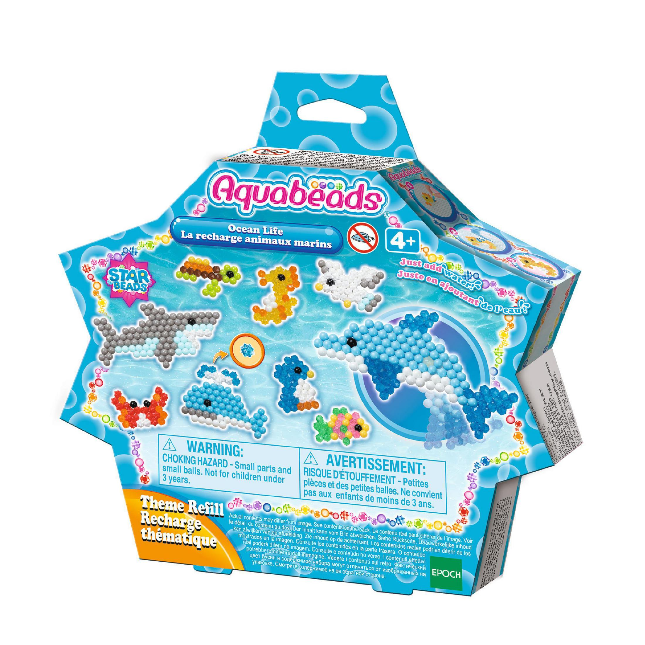 Aquabeads Ocean Life Set. Eine Box mit verschiedenen Perlen-Meereskreaturen und einem Delfin.