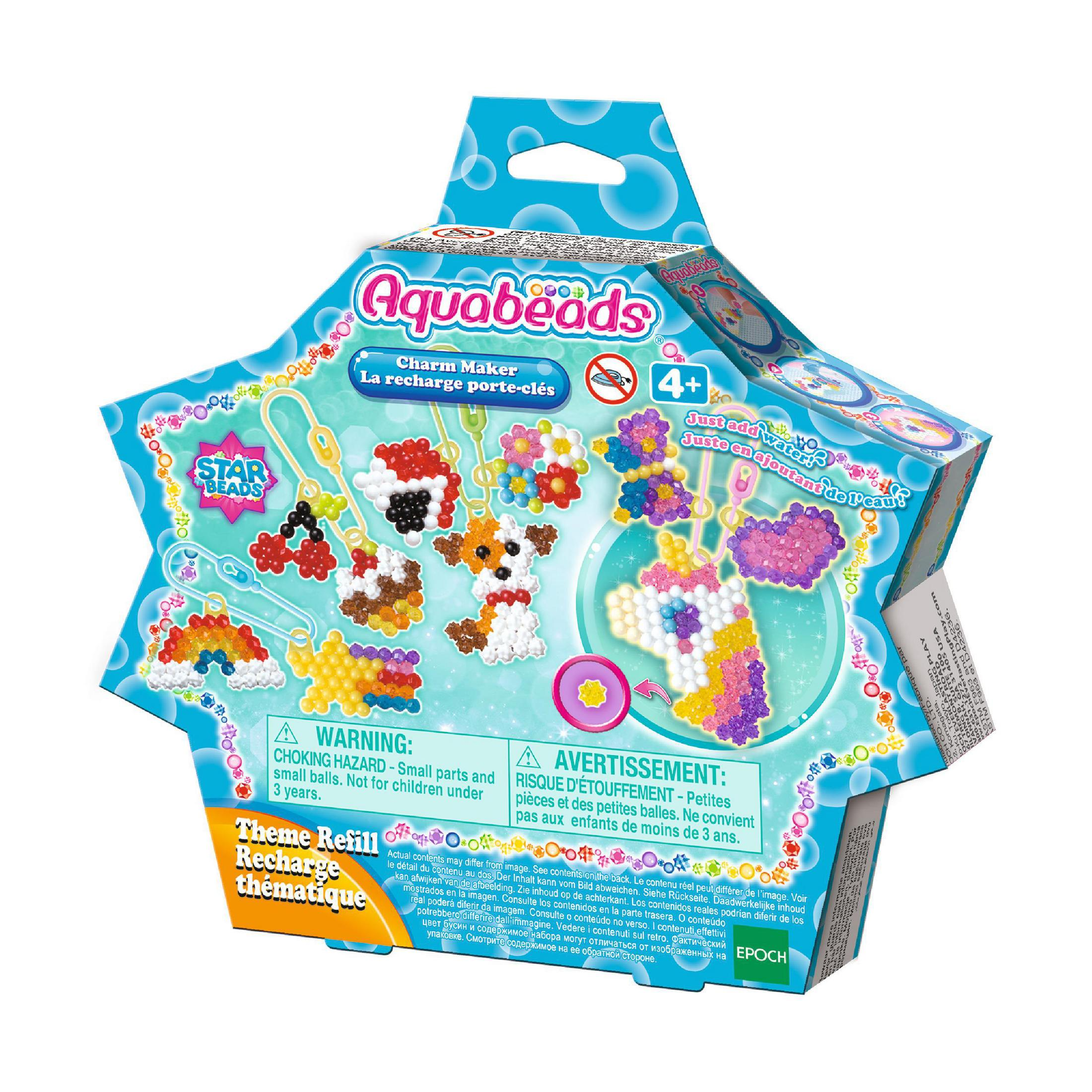 Eine sternförmige Box mit einem Spielzeug-Kit mit Perlen und Zubehör. Text in Englisch und Französisch.