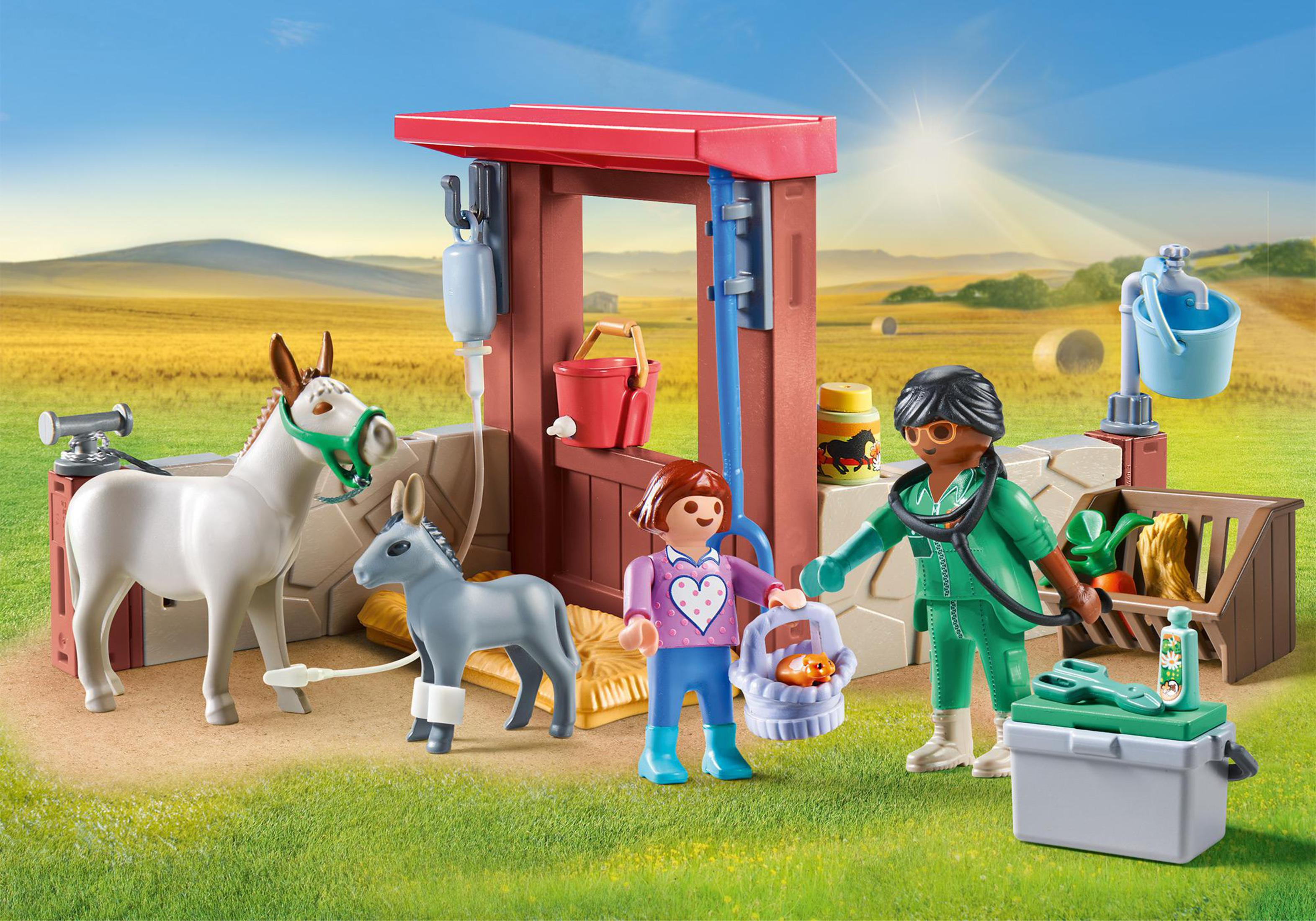 Set veterinario Playmobil con personaggi e animali.