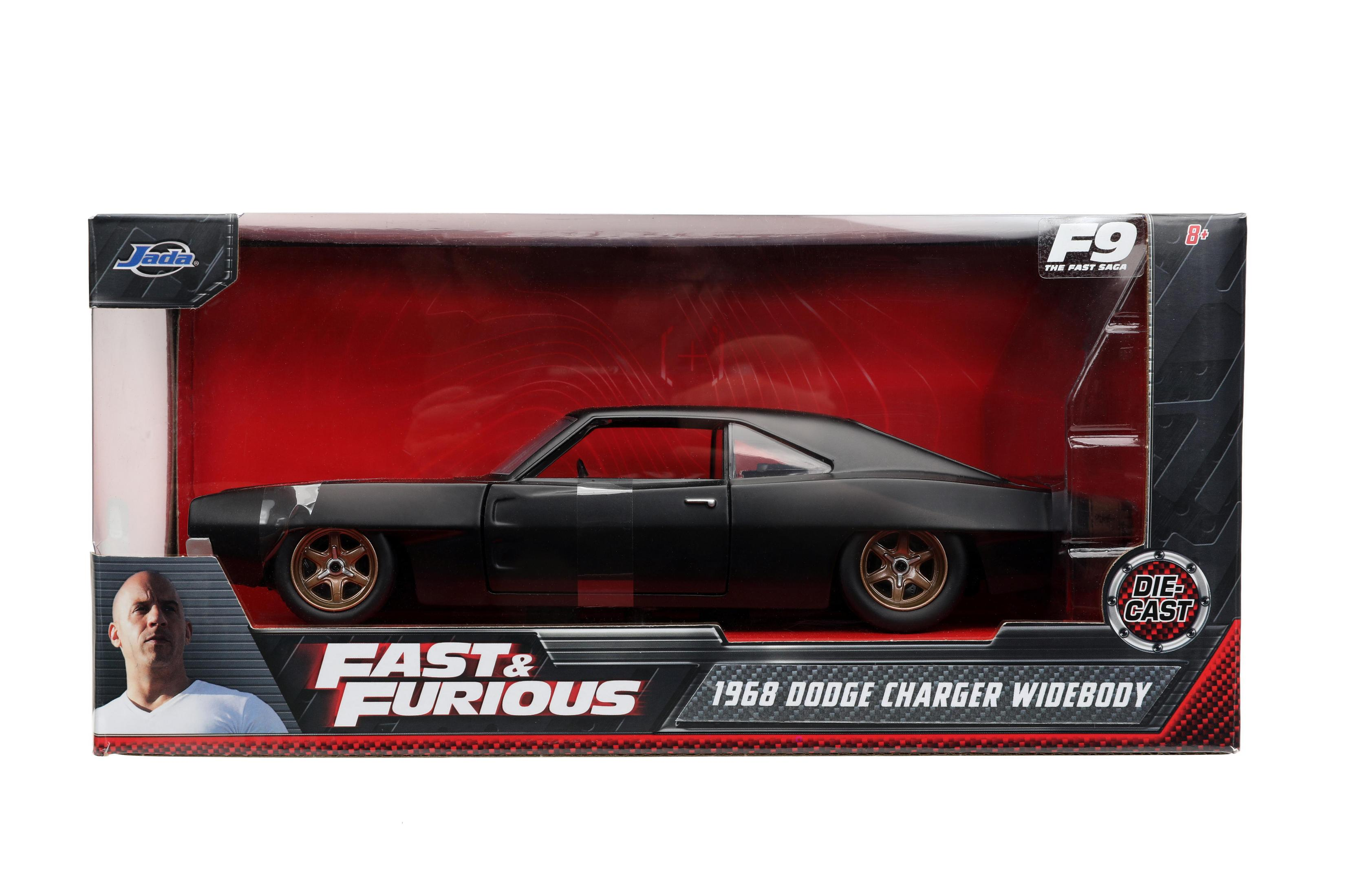 Schwarzes Fast & Furious Auto in einer Box. Roter Hintergrund.