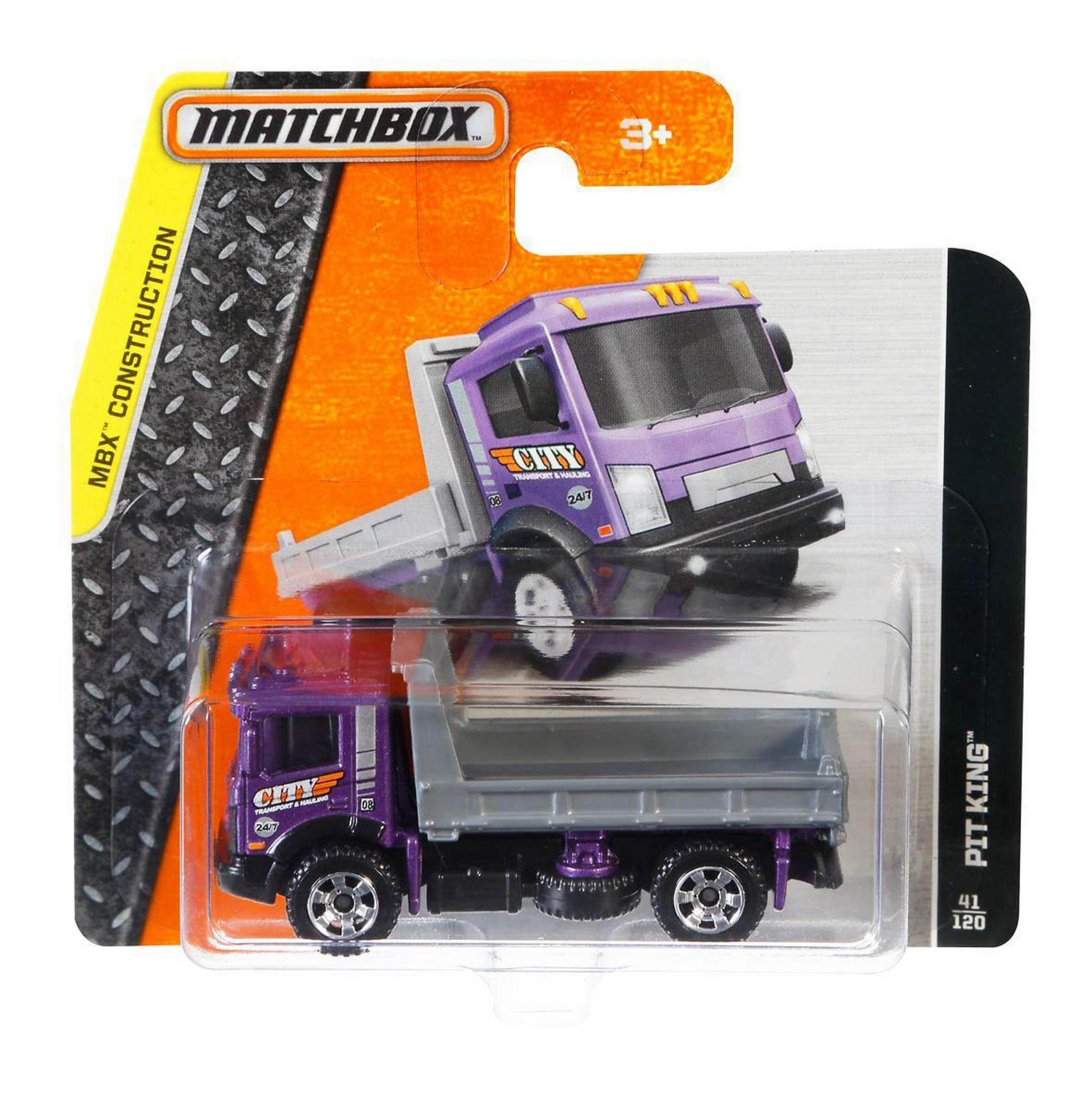 Camión de juguete Matchbox Pit King en embalaje. Cabina morada y volquete gris.