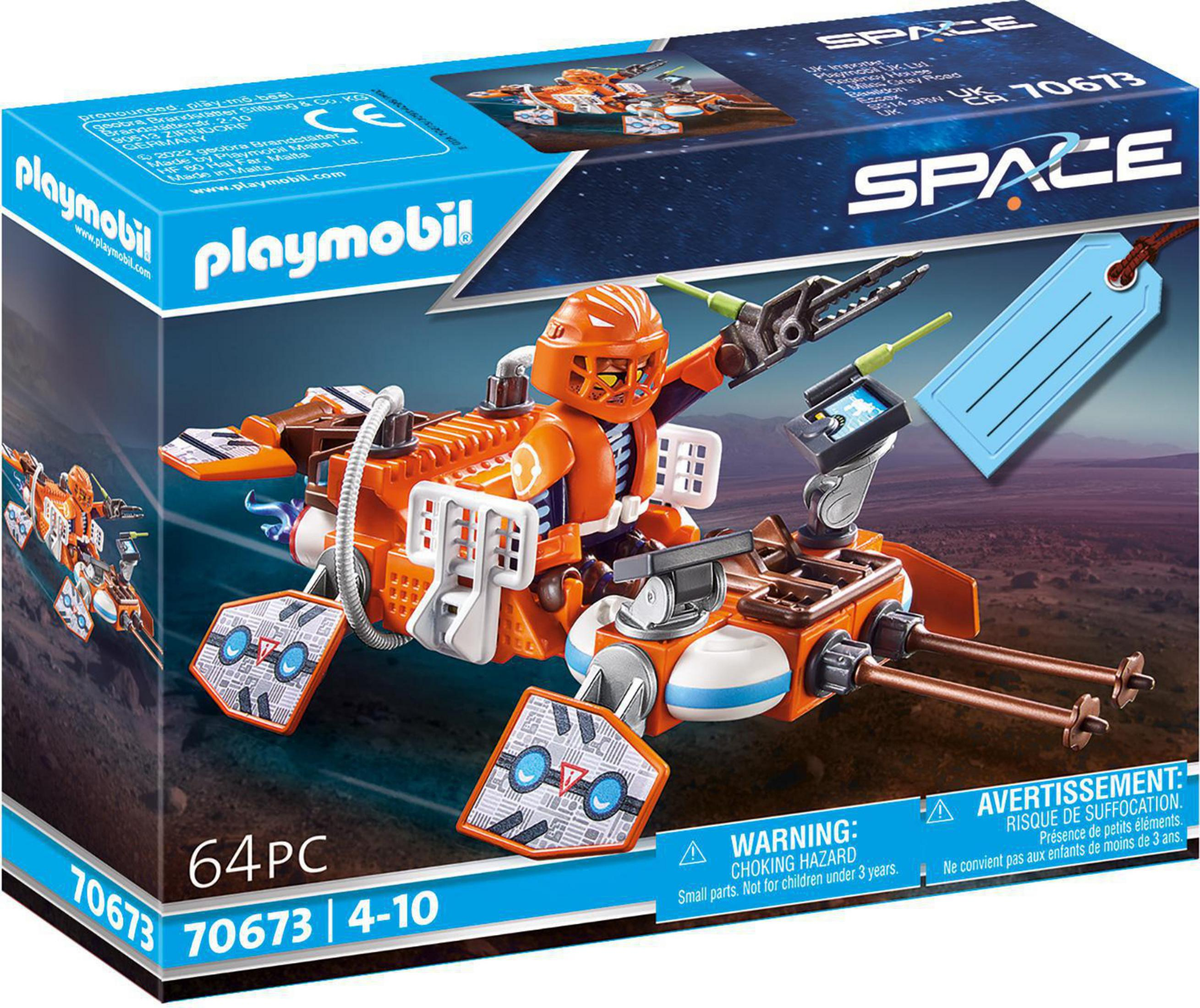 Playmobil Weltraum-Spielzeugset-Box mit einem orangefarbenen Astronauten auf einem Fahrzeug mit Werkzeugen und einem blauen Anhänger.