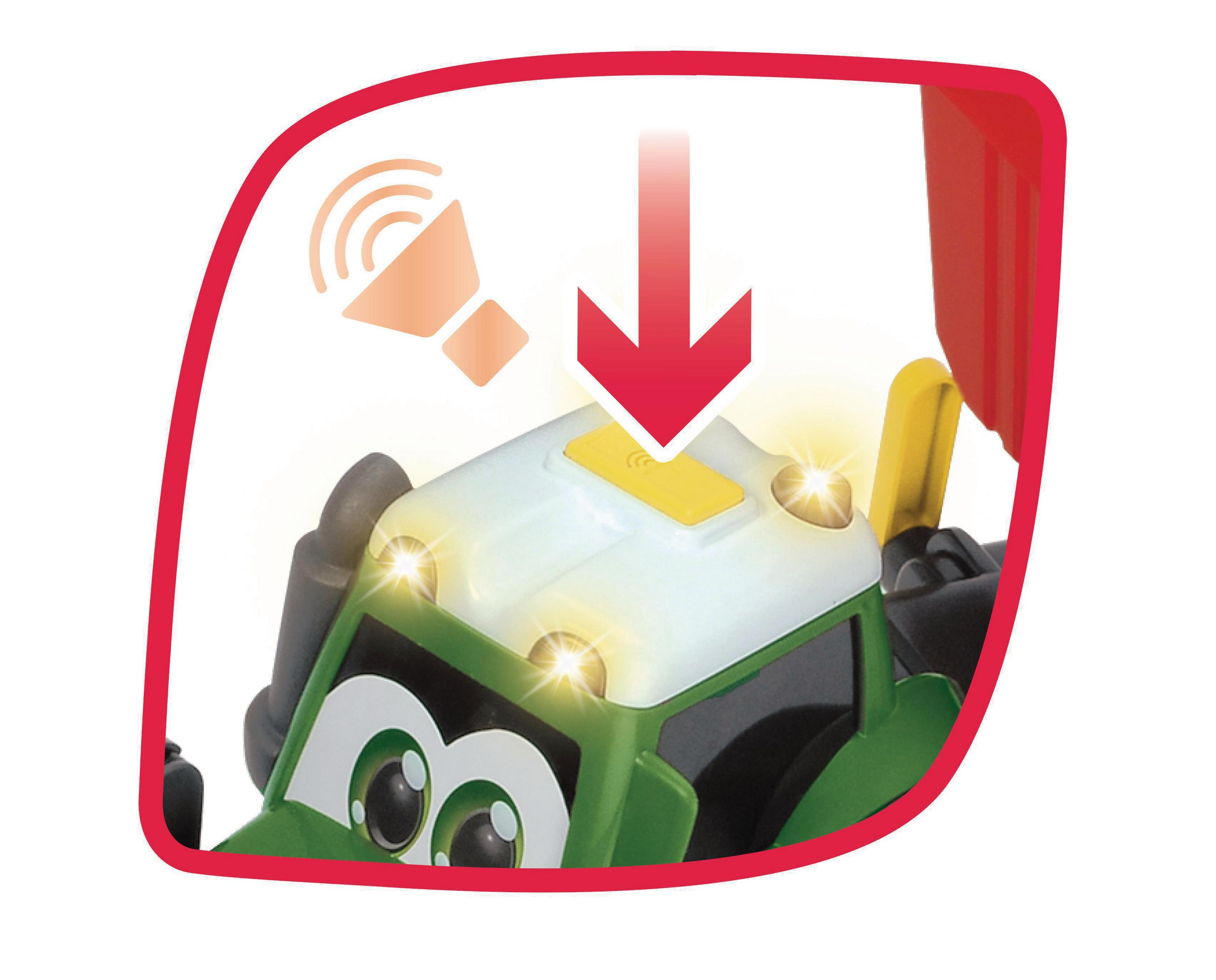 Nahaufnahme eines grünen Spielzeugtraktors. Licht- und Tonsymbol. Roter Rahmen.