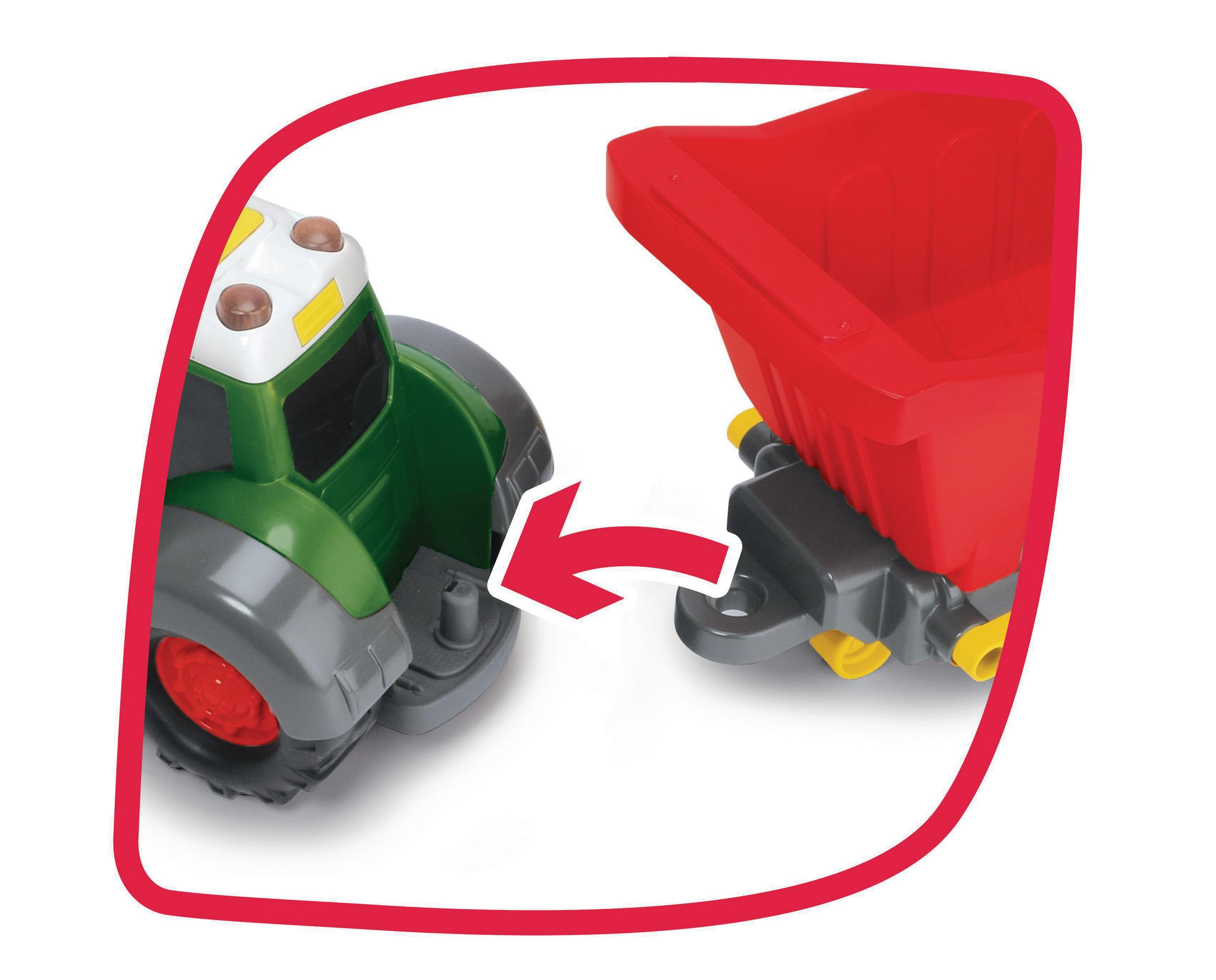 Ein Spielzeugtraktor und Anhänger sind verbunden. Der Traktor ist grün, der Anhänger rot.