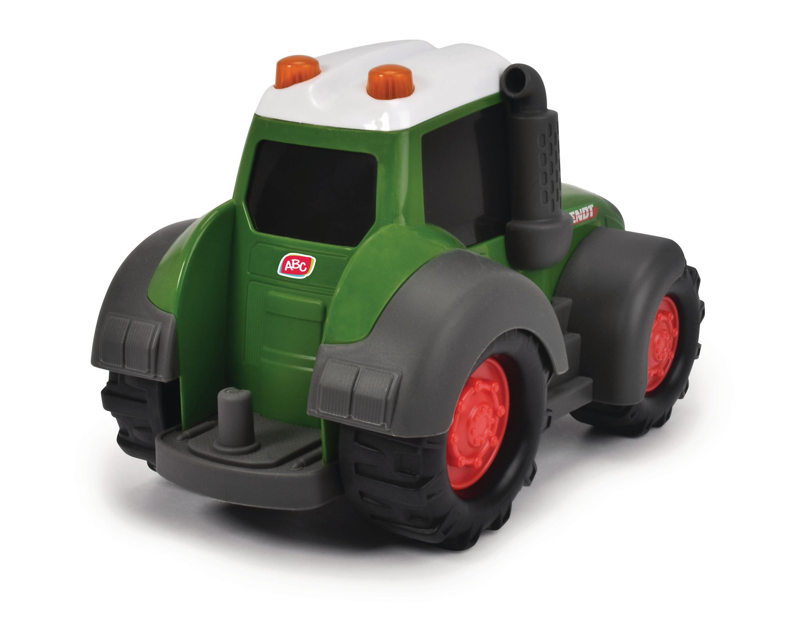 Ein grüner und weißer Spielzeugtraktor mit roten Rädern und weißem Dach. Das Wort 'FENDT' ist sichtbar.