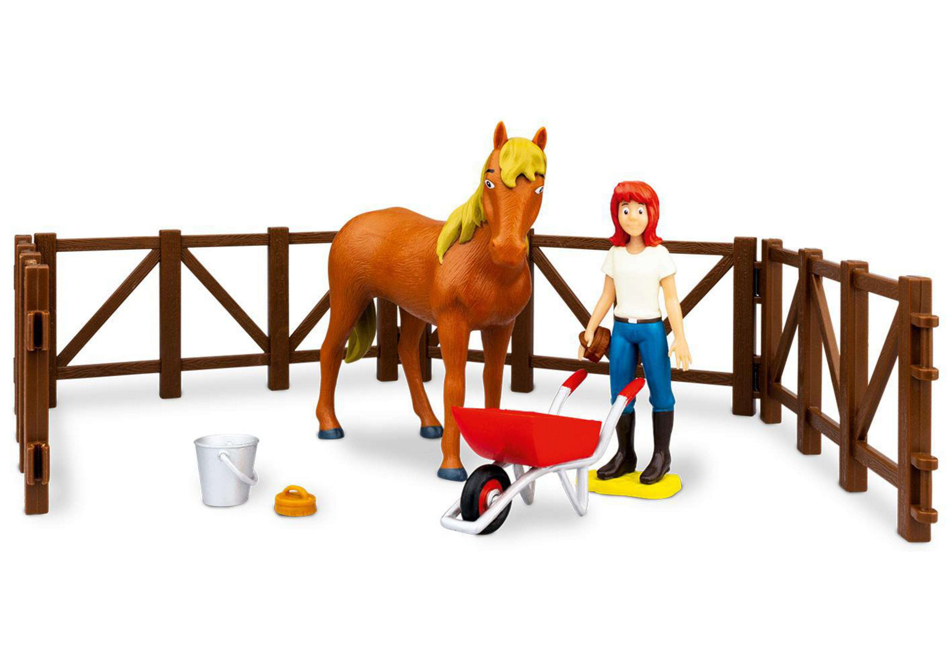 Spielzeugpferd und Mädchen mit Zaun und Zubehör. Braunes Pferd, Mädchen in Jeans.