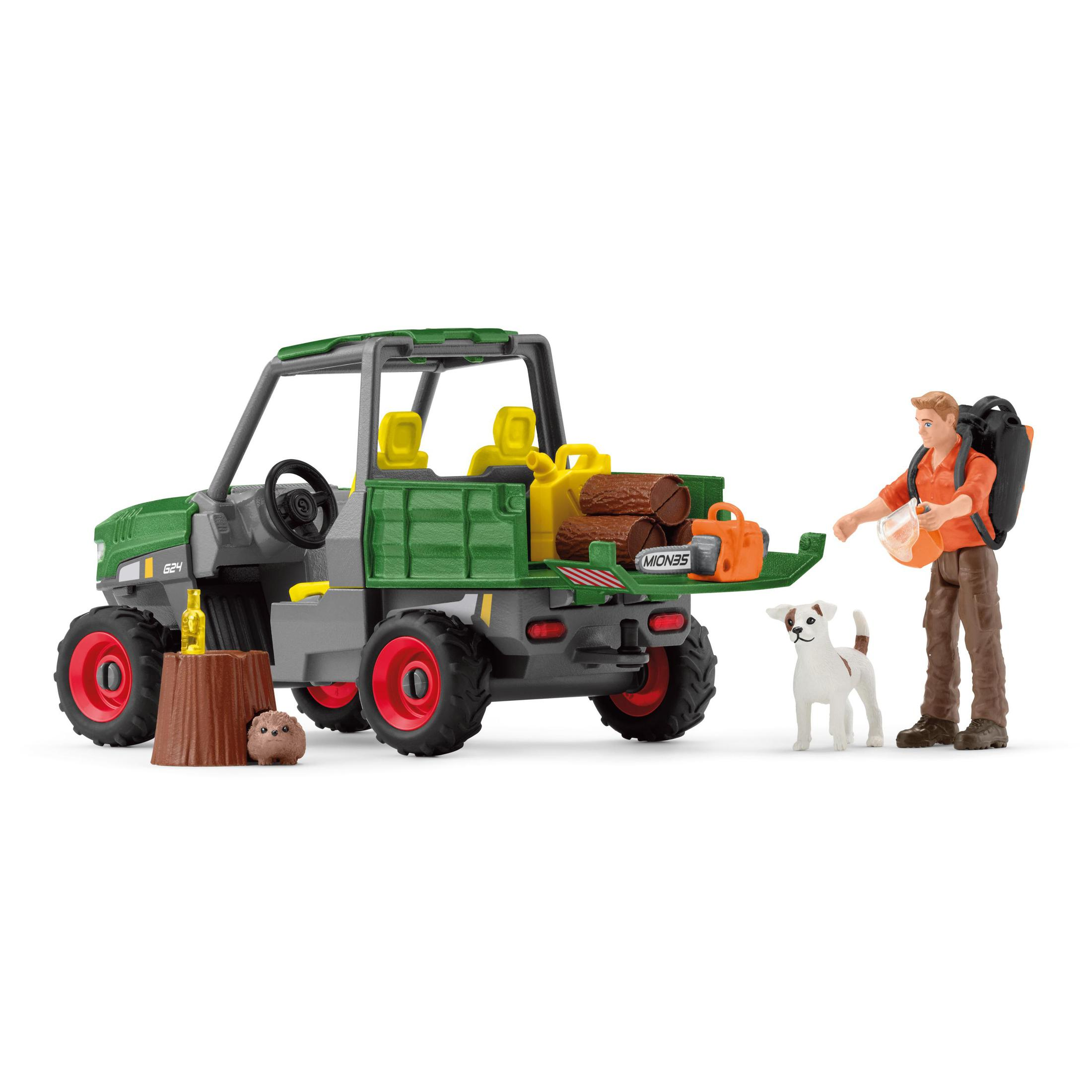 A man with a dog near a utility vehicle with logs.