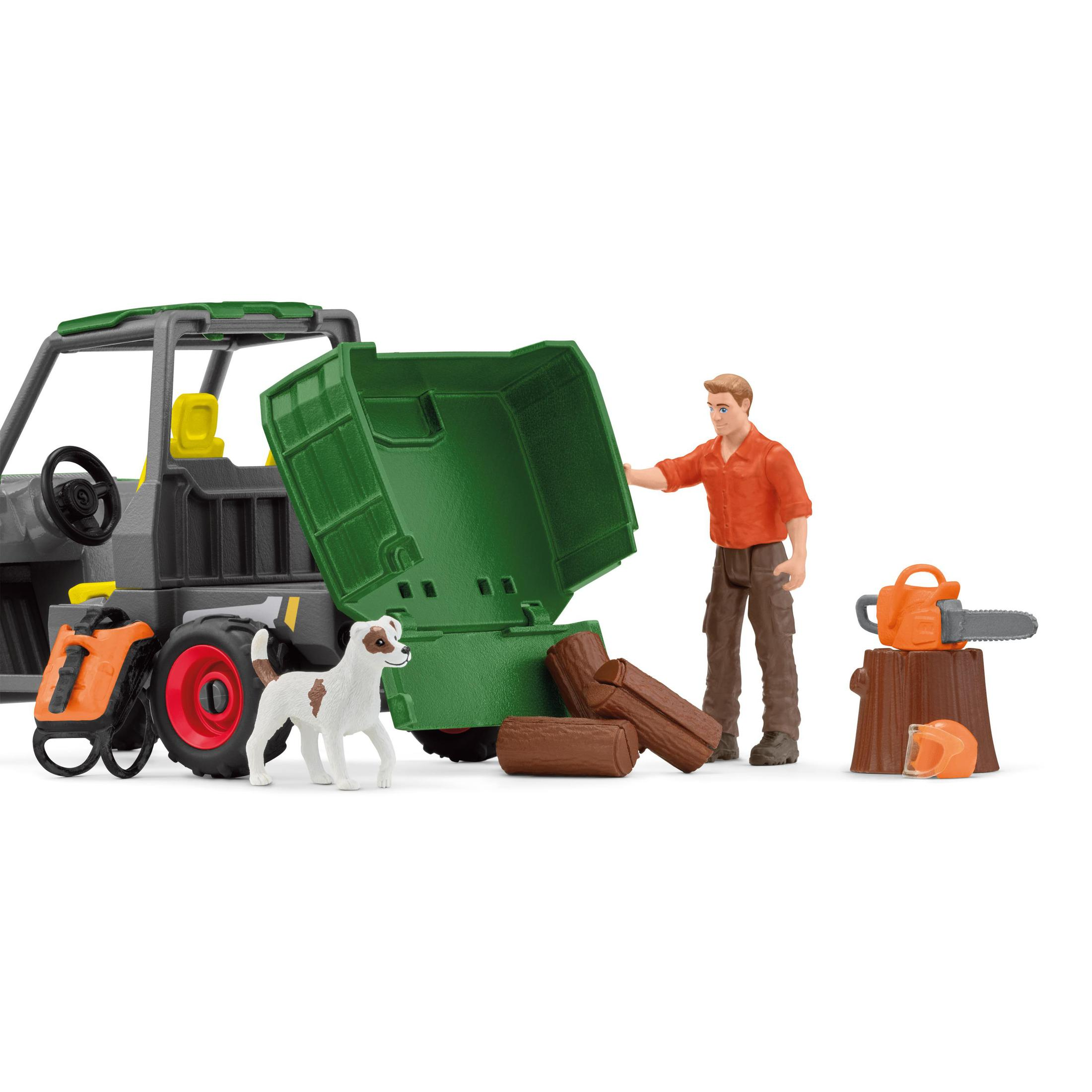 A toy scene: a man and a dog are near a truck with an open green bed, a chainsaw and helmet.