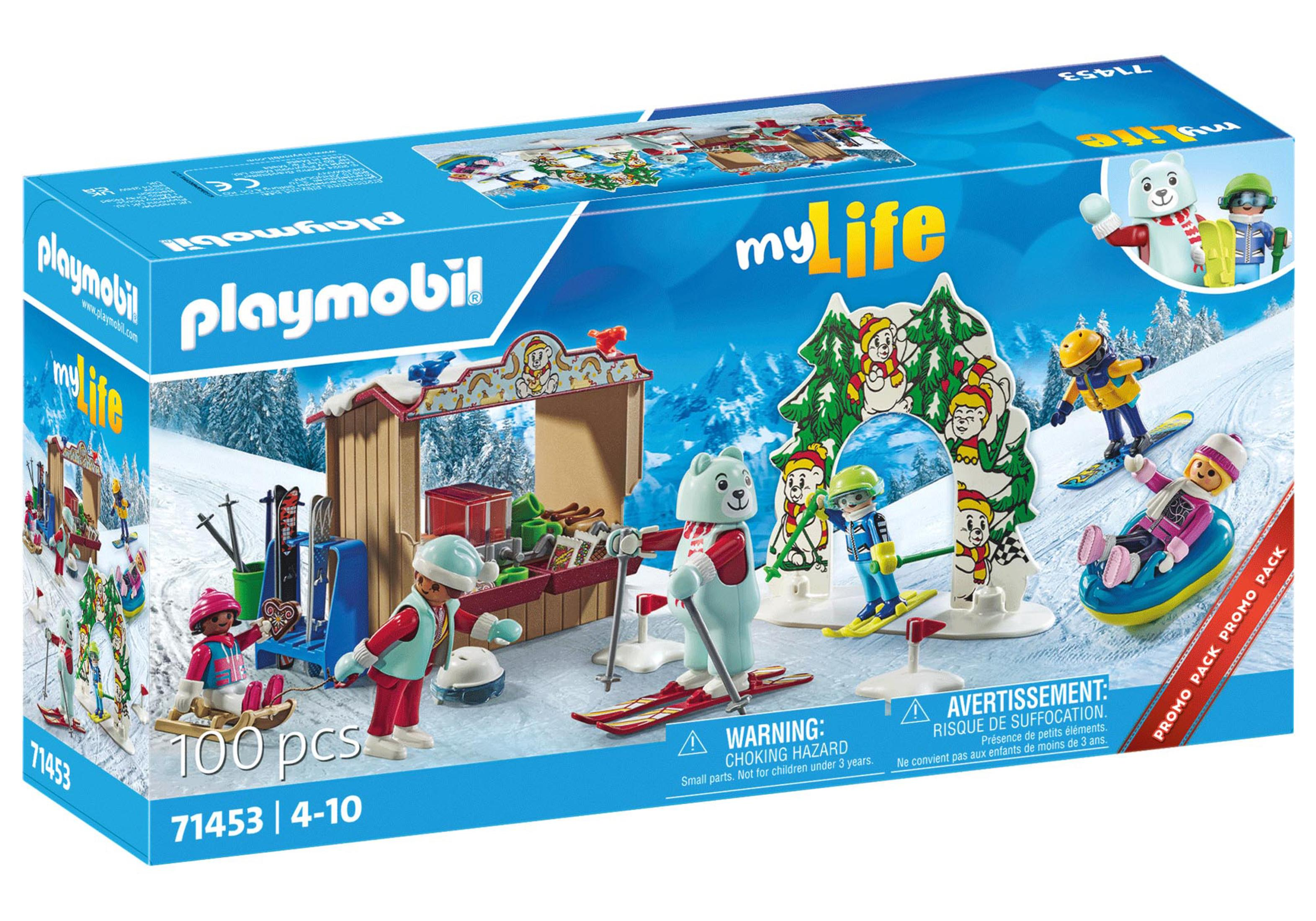 Set di scatole Playmobil, una scena sciistica innevata con personaggi, una seggiovia e un orso.