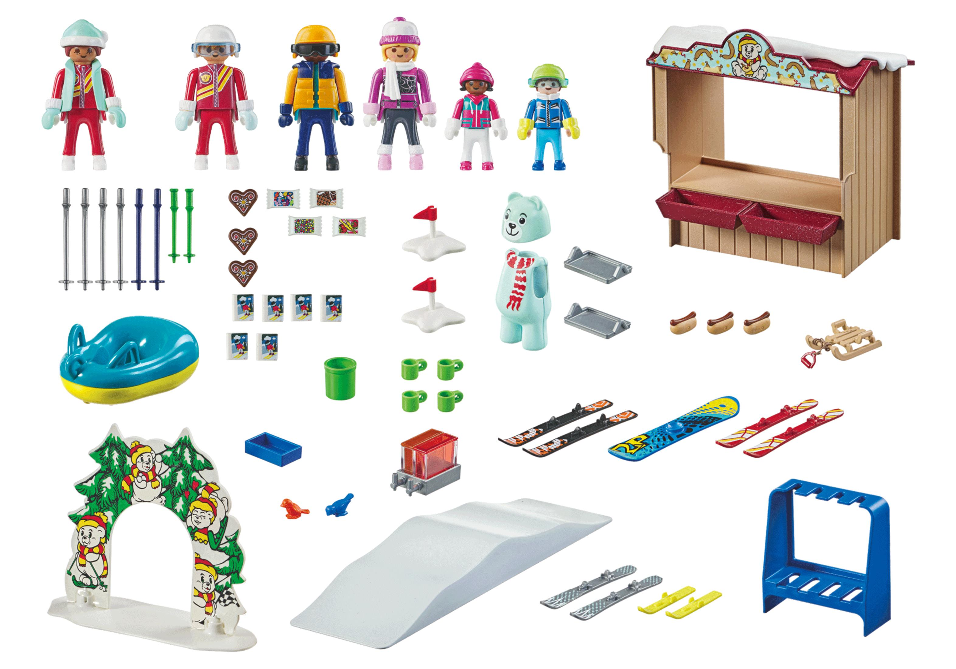 Una collezione di giocattoli Playmobil a tema invernale, tra cui personaggi e accessori.