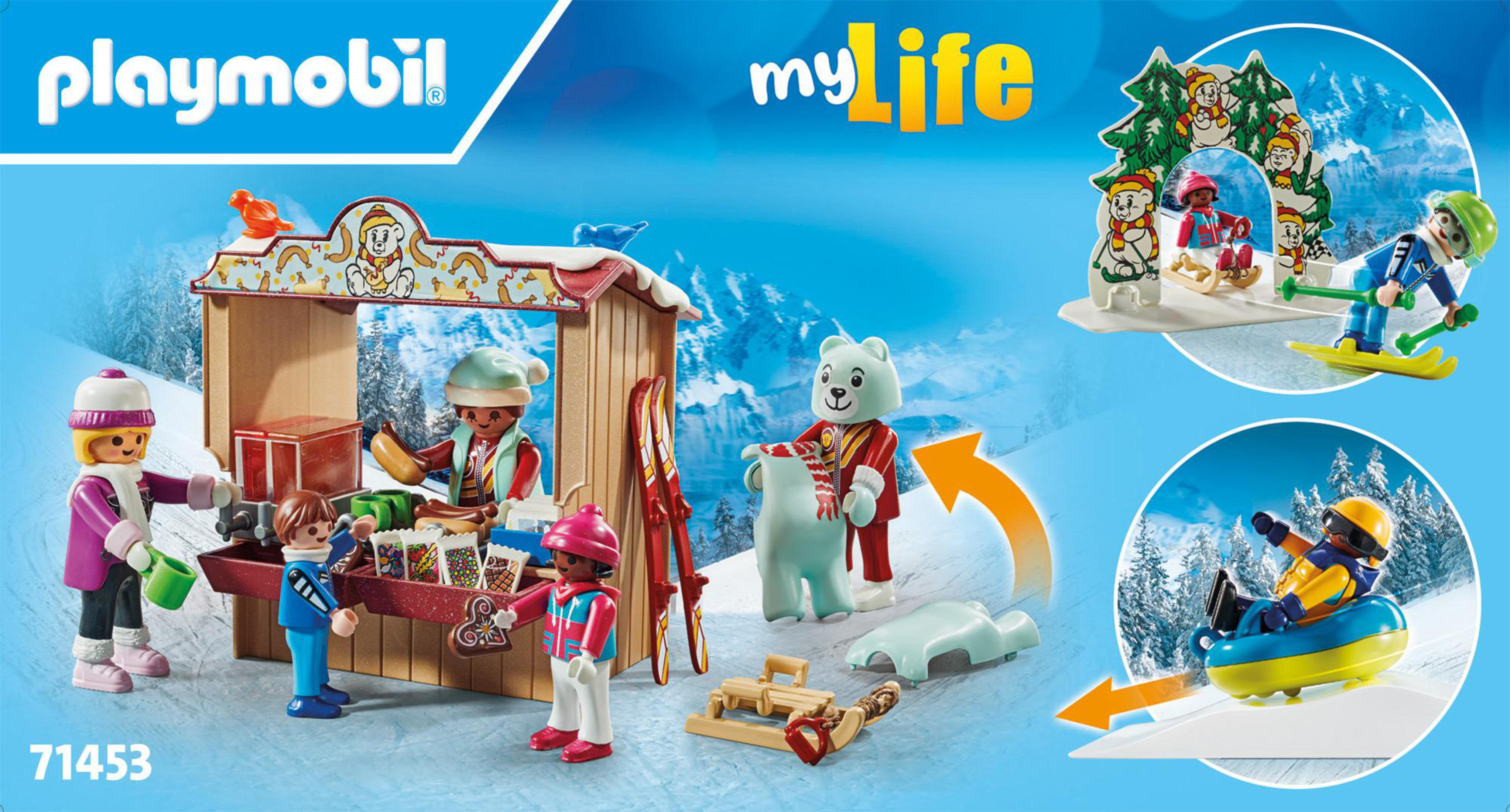 Scena invernale Playmobil con personaggi e negozio. Sciatori, neve e un orso polare. Codice prodotto 71453.