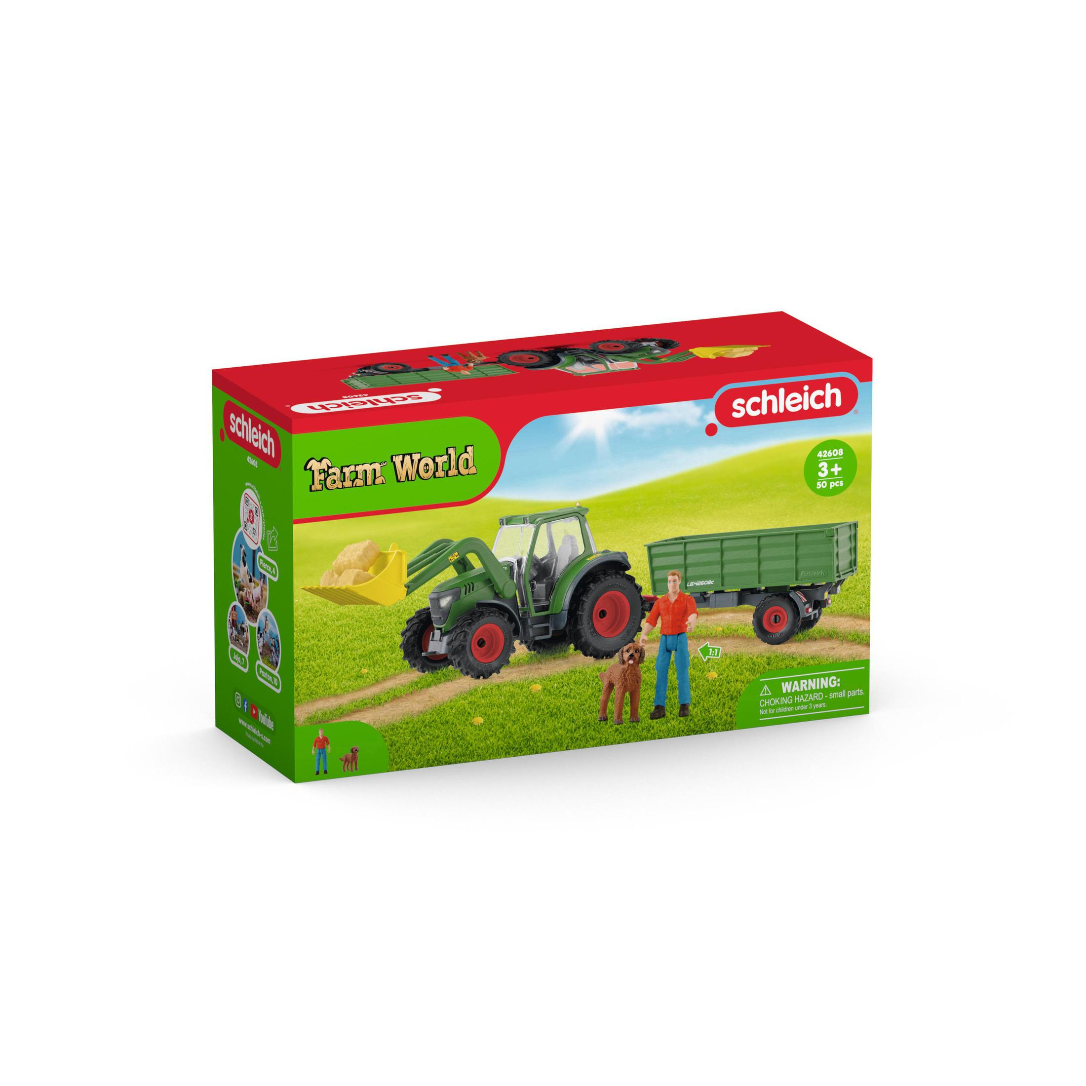 Eine Spielzeugkiste zeigt einen grünen Traktor, einen Anhänger, einen Bauern, einen Hund und ein Feld, alles in einer Farmumgebung.