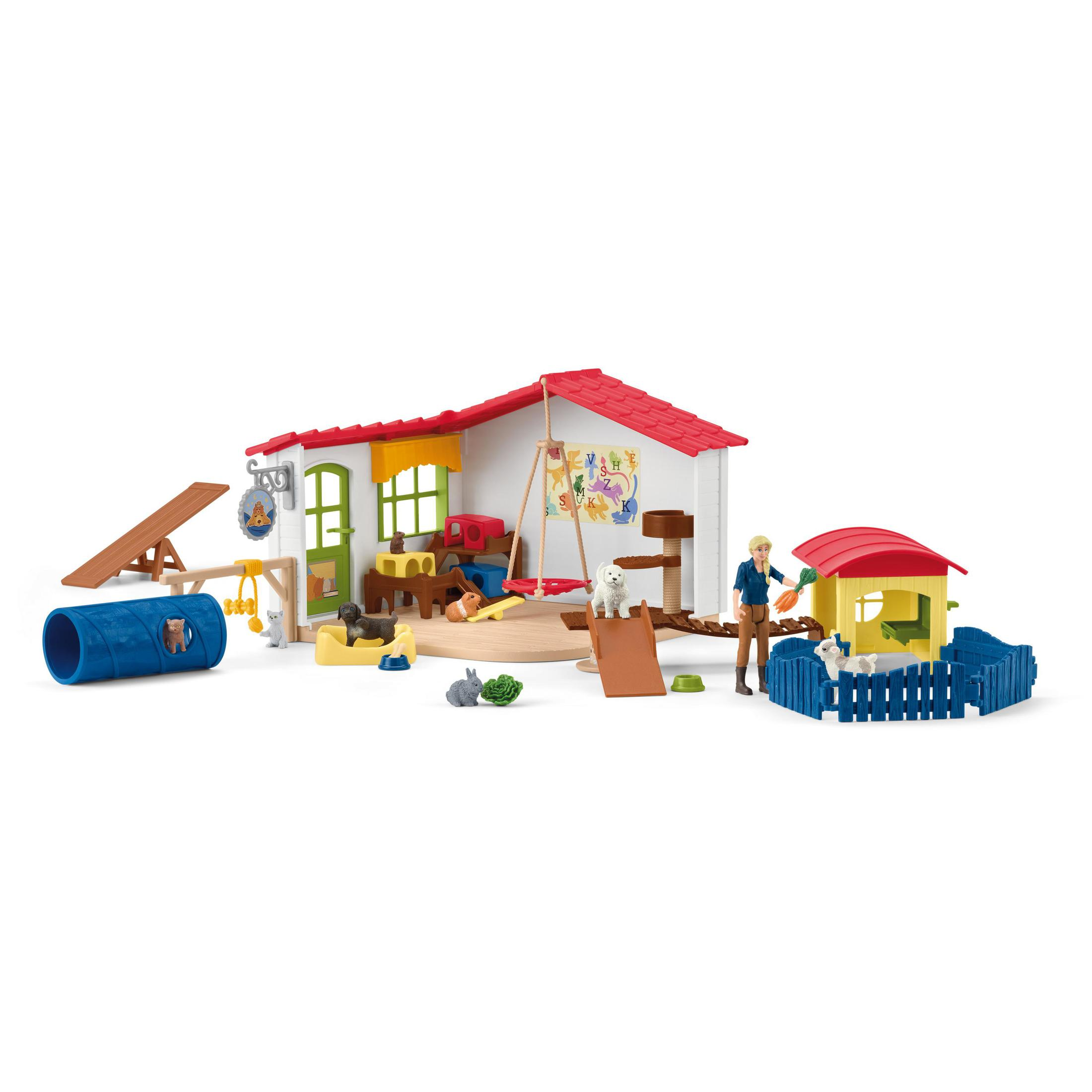 Un playset per negozi di animali con animali, accessori e una struttura a forma di casa.