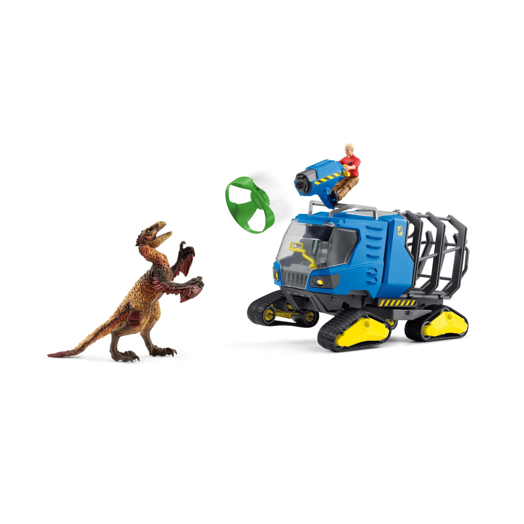 A toy with a dinosaur and a vehicle. A person is on top of the vehicle. White background.