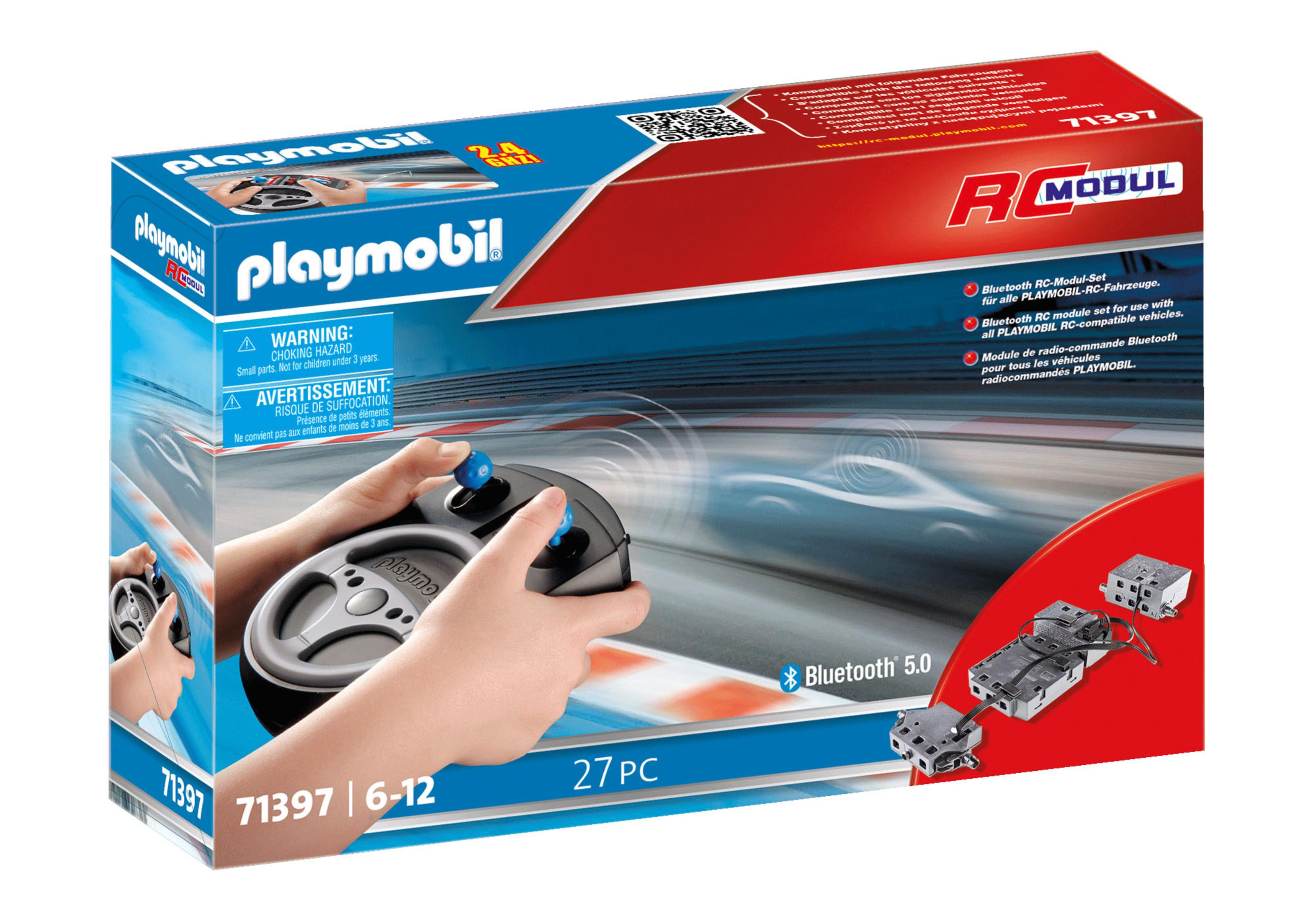Eine Playmobil RC Auto Modul Box mit einem Lenkrad Controller und Autoteilen.