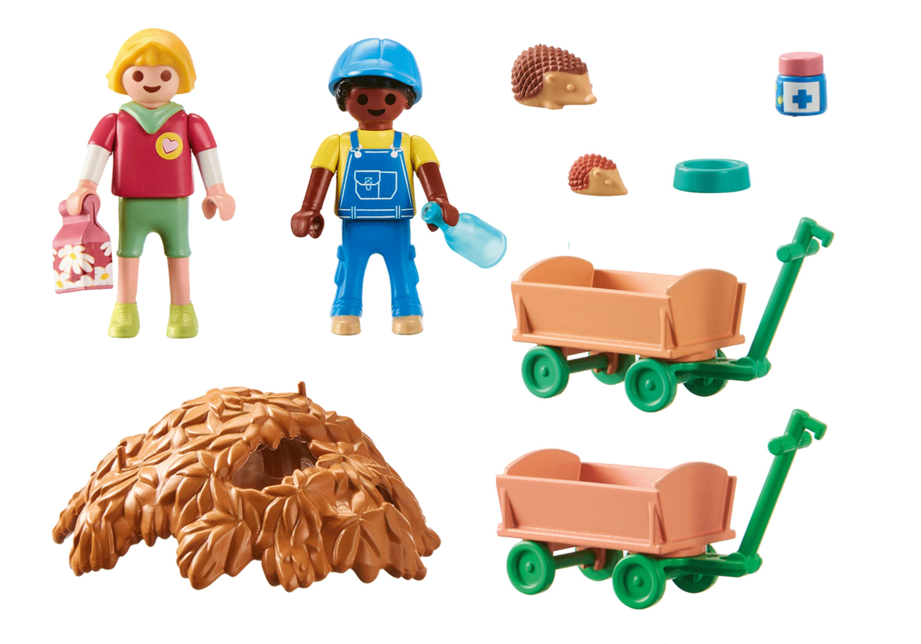 Set Playmobil con due figure, due carrelli, un rifugio di foglie, due ricci e una bottiglia di medicina blu.