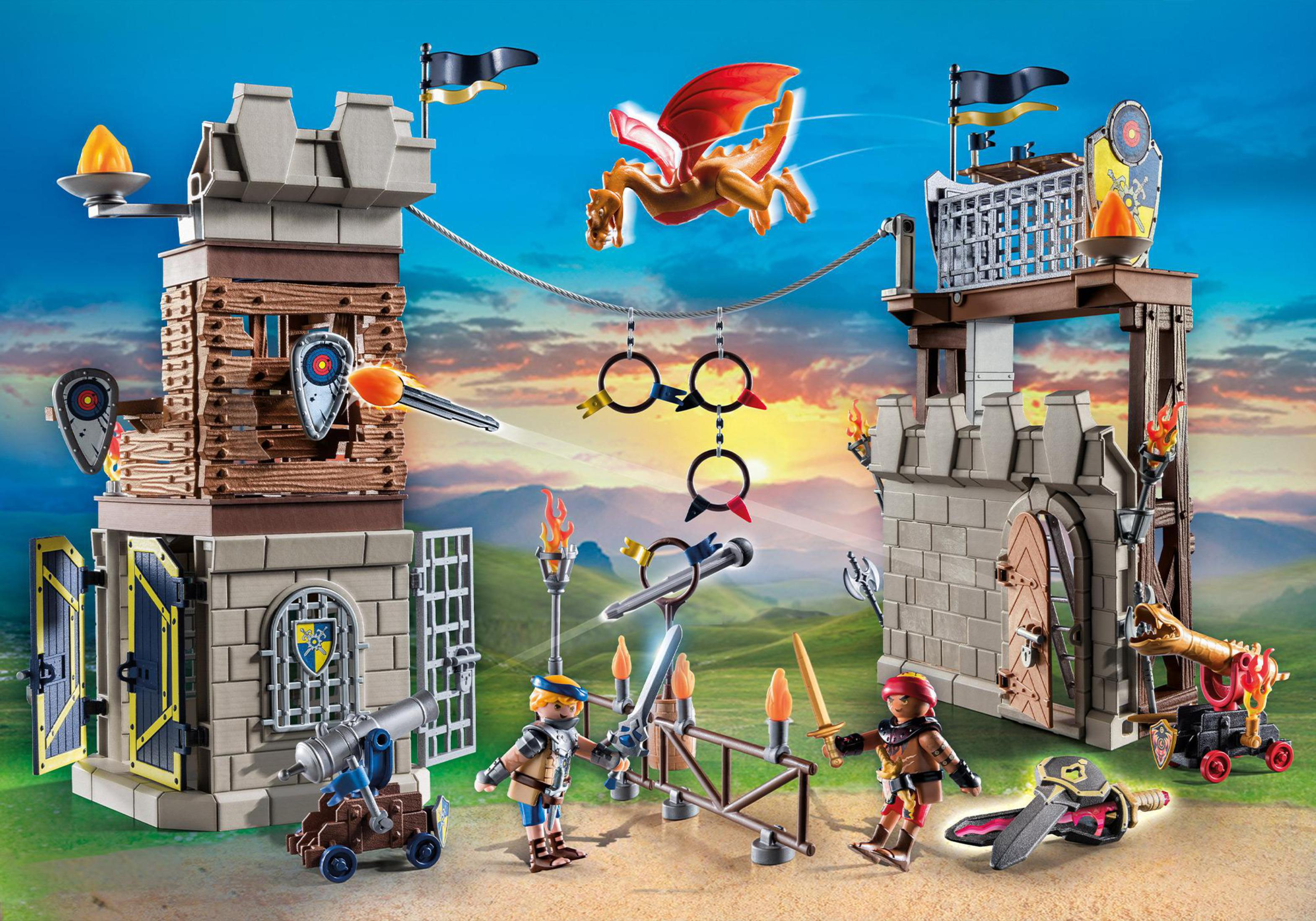 Ein Playmobil-Burg-Set mit Rittern, Drachen und Kanonen. Der Hintergrund ist ein blauer Himmel.